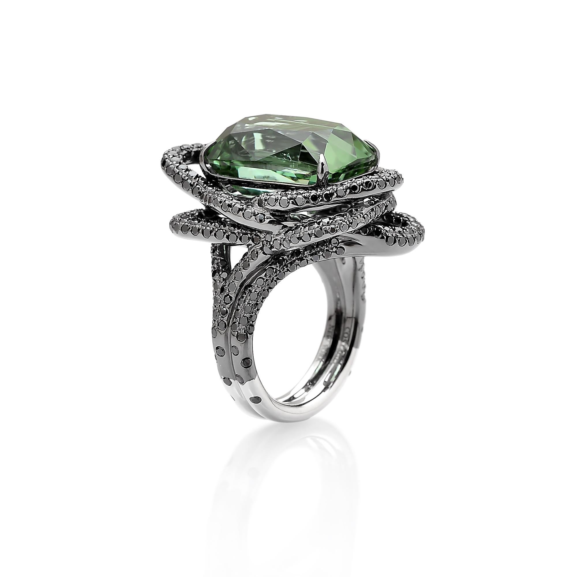 From the 'Intrecci' Collection, faceted cushion shape green tourmaline ring set in 18 karat white gold with black rhodium finish and pave-set black diamond detailing. 

The beauty is in the details - from the combination of hues, the cut of the