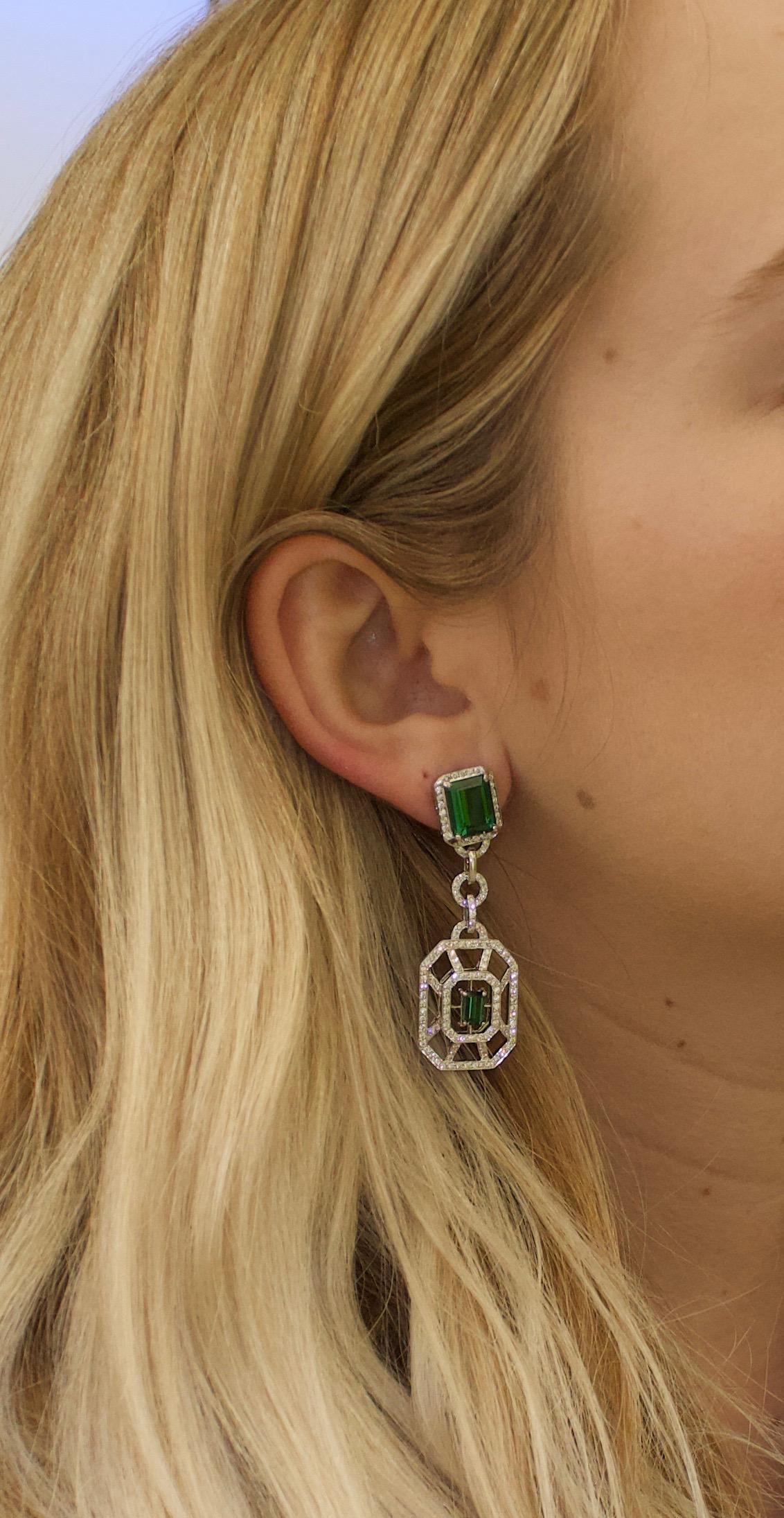Green Tourmaline and Diamond Dangling Earrings in 18k White Gold
Two Emerald Cut  Cut Green Tourmalines Weighing 7.20 Carats Approximately 
Two Emerald Cut  Cut Green Tourmalines Weighing 1.20 Carats Approximately 
292 Round Brilliant Cut Diamonds