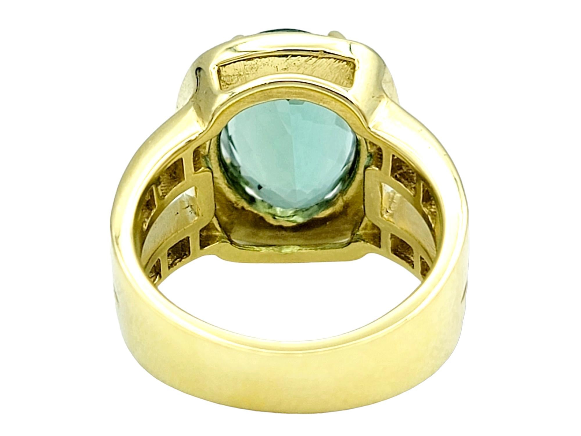 Women's Green Tourmaline and Diamond Halo Split Shank Cocktail Ring 18 Karat Yellow Gold For Sale