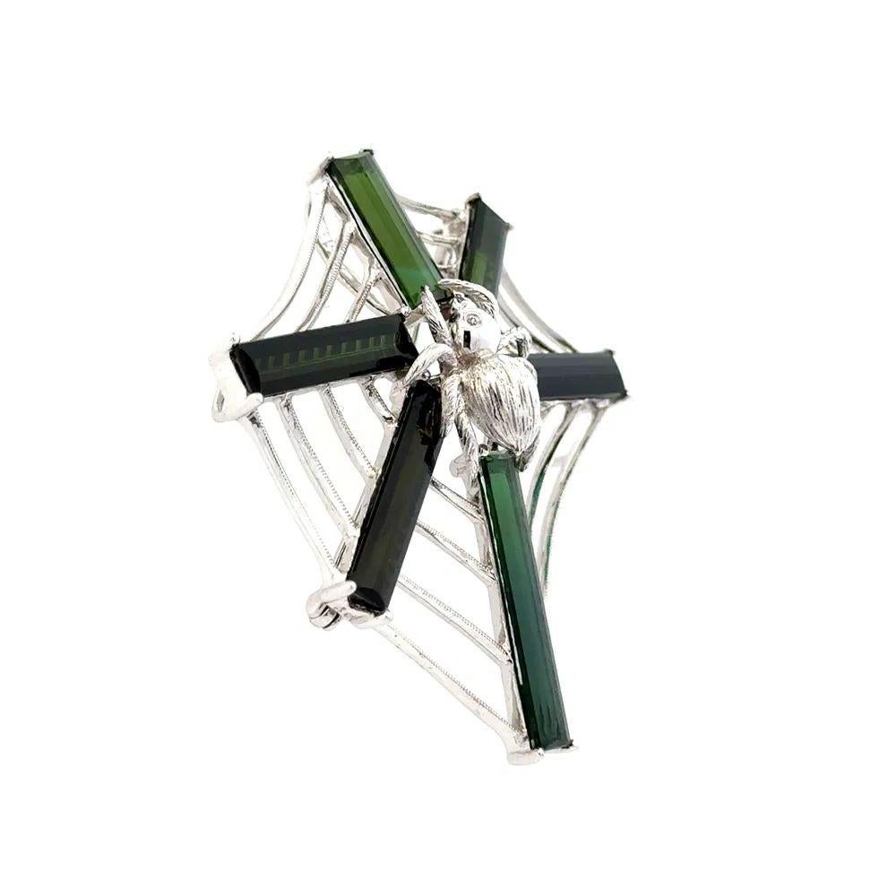 Simply Fabulous! Green Tourmaline and Diamond Spider Web Brooch Pendant. Securely Hand set with Long Green Tourmaline, weighing approx. 14.32tcw. Hand crafted Platinum mounting. Brooch measures approx. 1.9