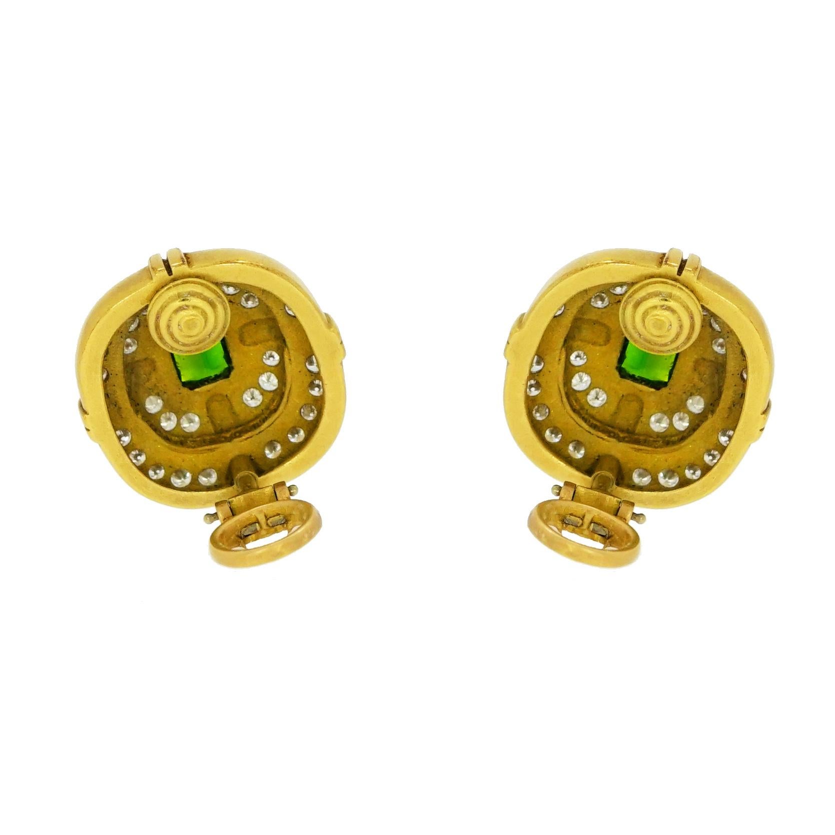 Looking for a intricately Cushion shaped halo design earrings in Yellow Gold... This is it!!
A non pierced clip backs centering an emerald cut Green Tourmaline and is accented by a double halo of 64 round white diamonds.
Measures approximately