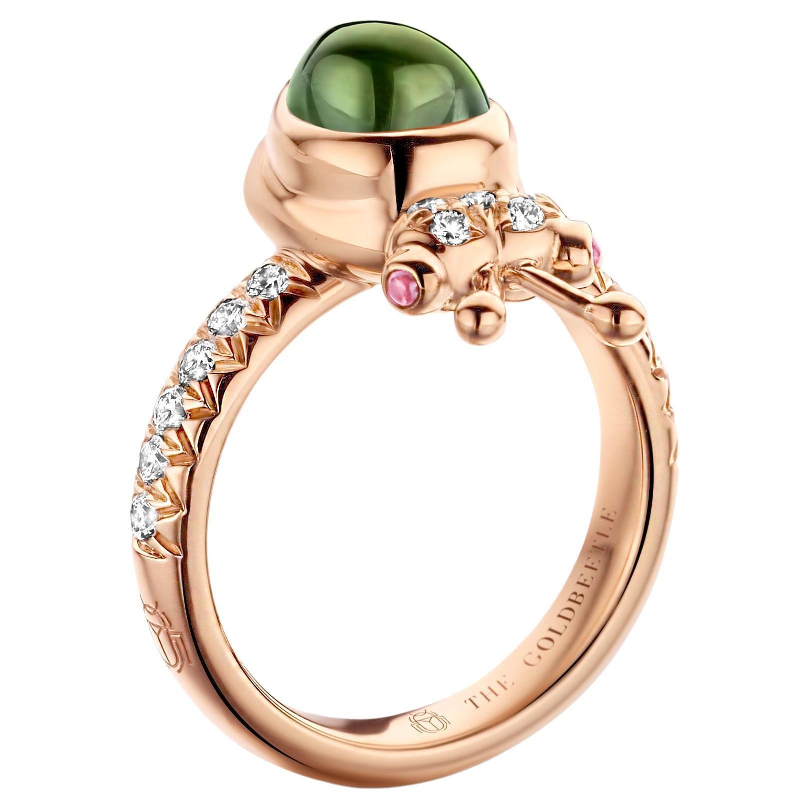 One-of-a-kind lucky beetle ring in 18 karat rose gold 8,6 g set with the finest diamonds in brilliant cut 0,34 carat (VVS/DEF quality) one natural, green tourmaline in pear cabochon cut and two pink tourmalines in round cabochon cut.
