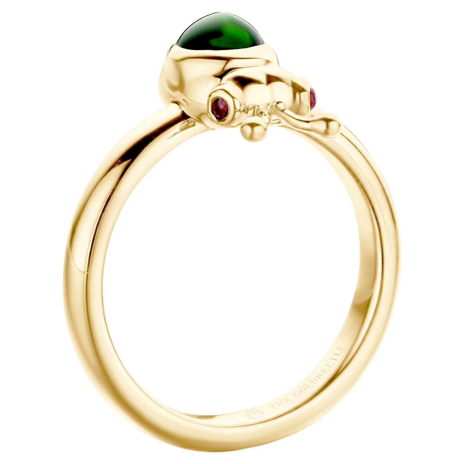 18-karat yellow gold Lilou ring set with one natural pear-shaped cabochon Green Tourmaline and two natural Pink Tourmalines in round cabochon cut.
Celine Roelens, a goldsmith and gemologist, specializes in unique, fine jewelry, handmade in Belgium