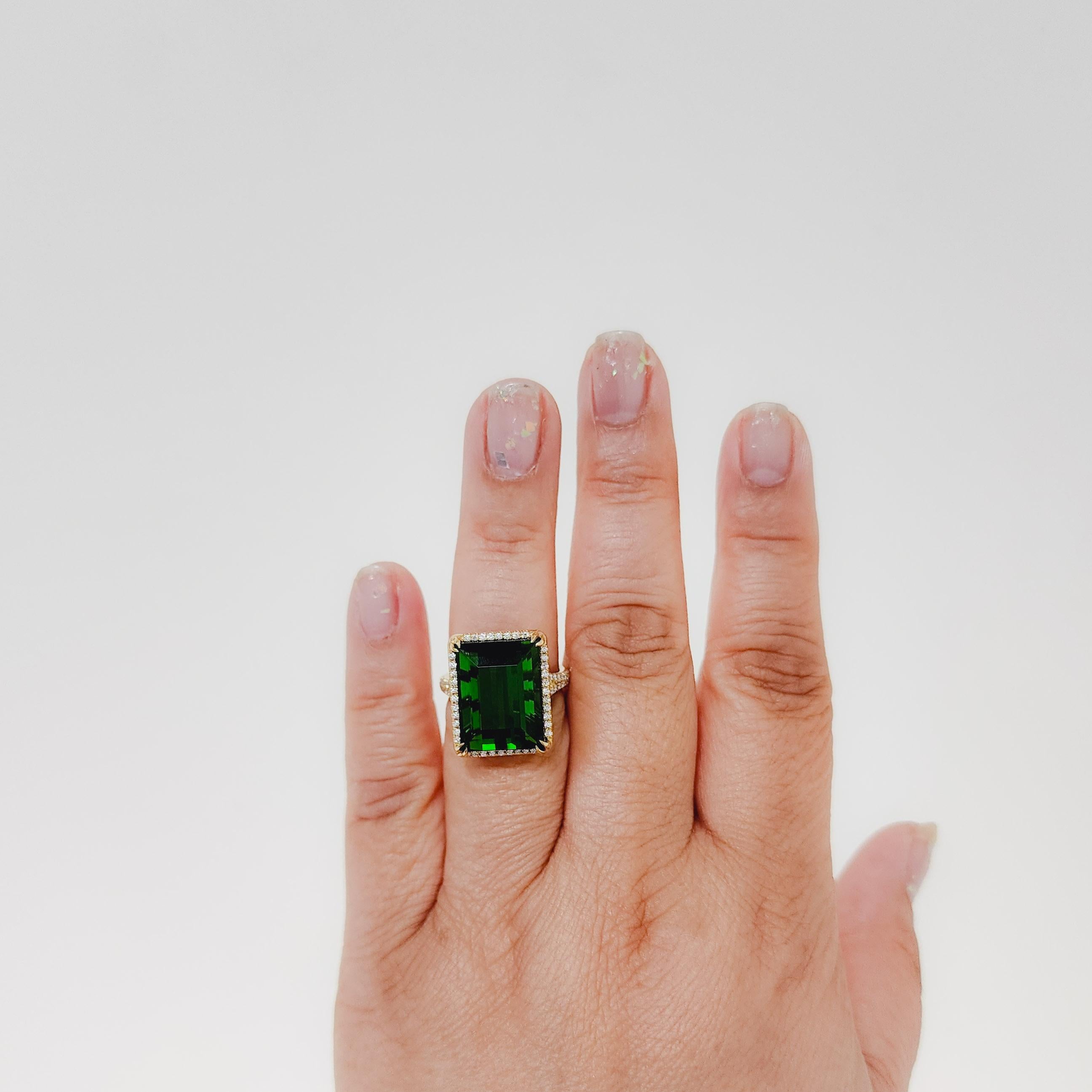 Gorgeous 19.63 ct. green tourmaline emerald cut with 0.52 ct. good quality white diamond rounds.  Handmade in 18k yellow gold. Ring size 6.5.