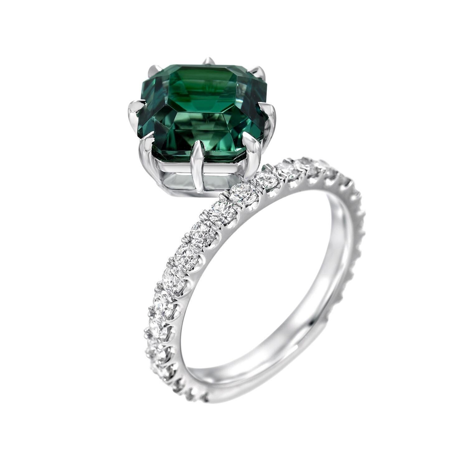 Pristine 4.17 carat square emerald cut, vivid Green Tourmaline and 0.82 carats total of round brilliant diamonds, are hand set in this unique 8 claw prong, cocktail platinum ring. This vibrant Green Tourmaline showcases superior color, cut and