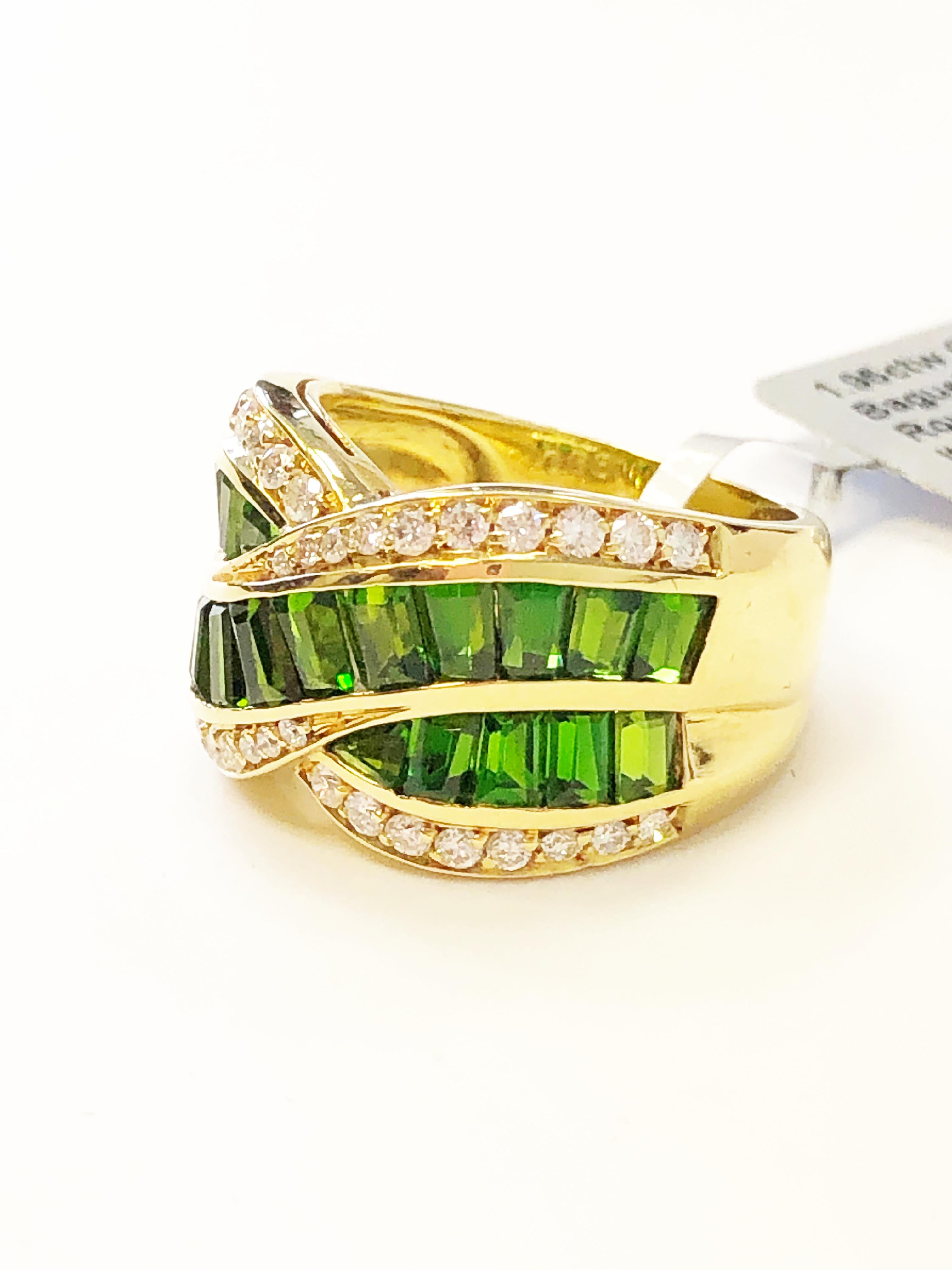 Beautiful green tourmaline baguettes weighing 1.95 carats with 0.66 carats of white diamond rounds in a handmade 18k yellow gold mounting.  The green tourmalines have a rich and bright green tone and the diamonds are good quality and white.  The