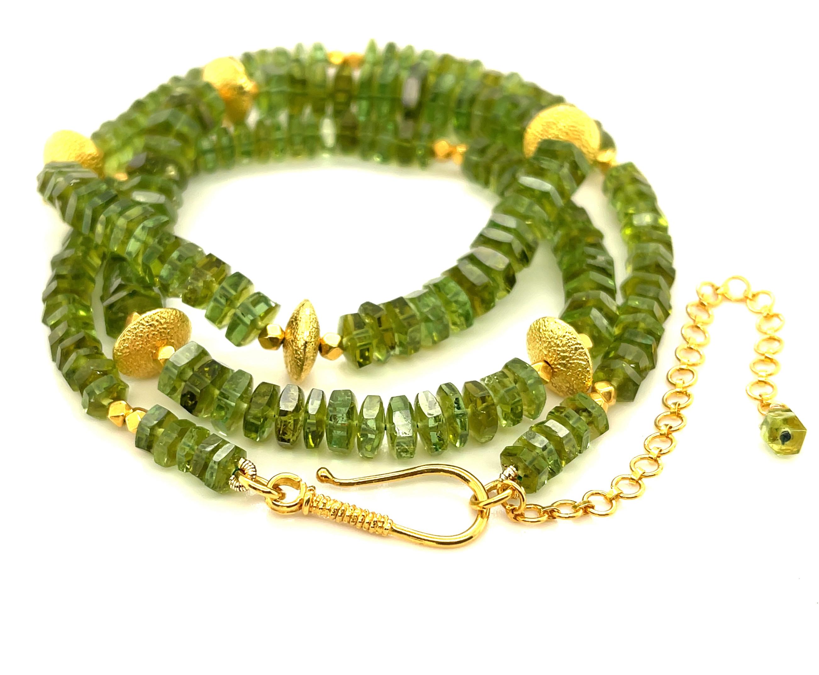 This strand of graduated green tourmaline beads is so pretty and unusual! The tourmaline gems graduate in size from 5.5 to 8.5mm in diameter and have been faceted as rondels that sparkle and catch the light, showing off their beautiful leaf-green