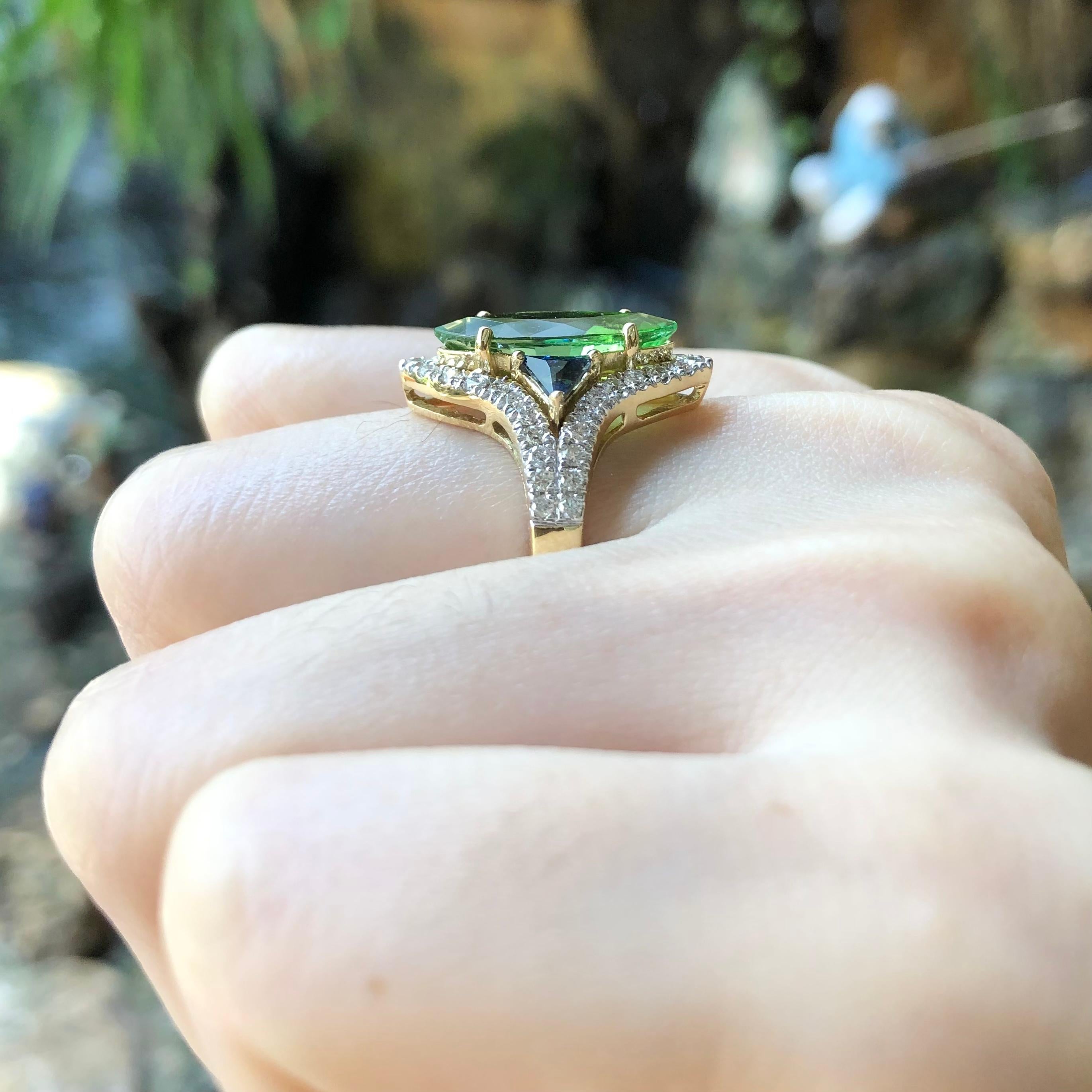 Green Tourmaline 2.84 carats, Blue Sapphire 0.53 carat and Brown Diamond 0.55 carat Ring set in 18 Karat Gold Settings

Width:  1.8 cm 
Length: 2.1 cm
Ring Size: 54
Total Weight: 6.29 grams



