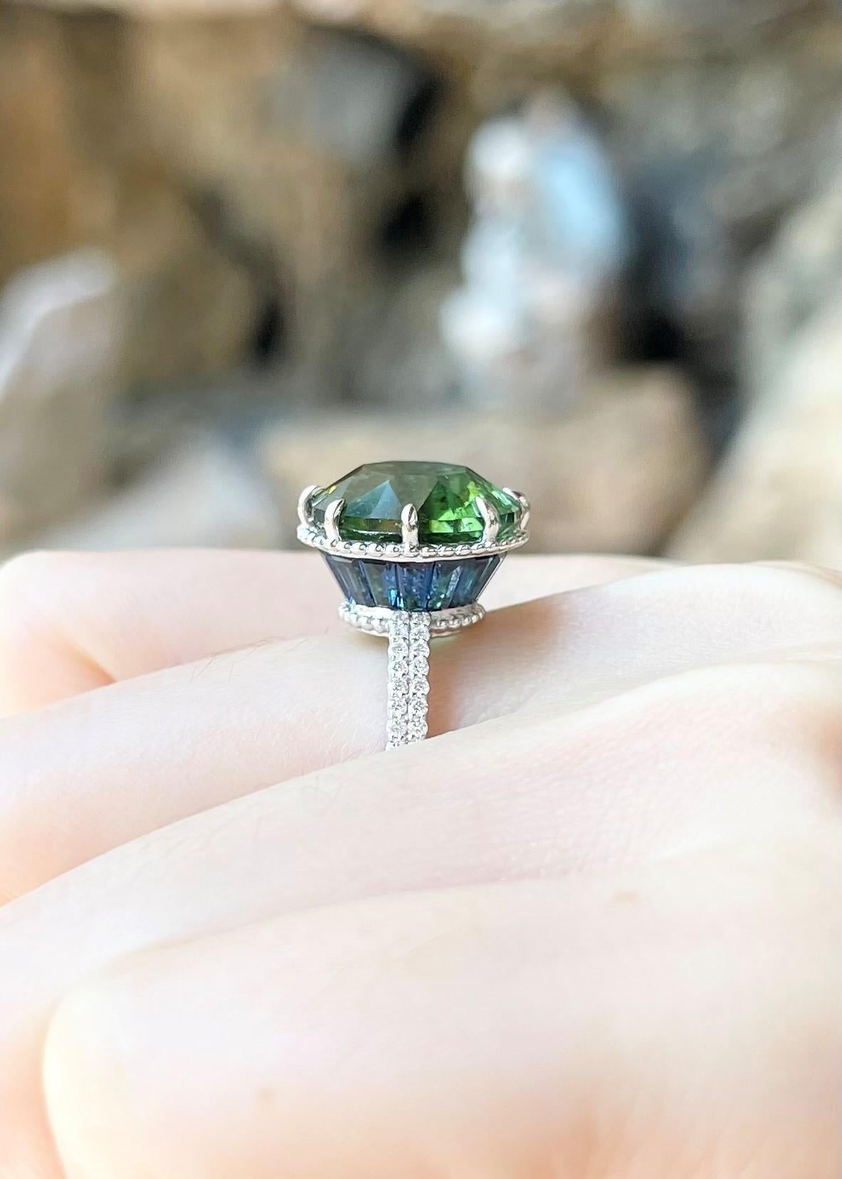 Green Tourmaline 6.90 carats, Blue Sapphire 3.11 carats and Diamond 0.23 carat Ring set in 18K White Gold Settings

Width:  1.3 cm 
Length: 1.3 cm
Ring Size: 54
Total Weight: 5.84 grams

