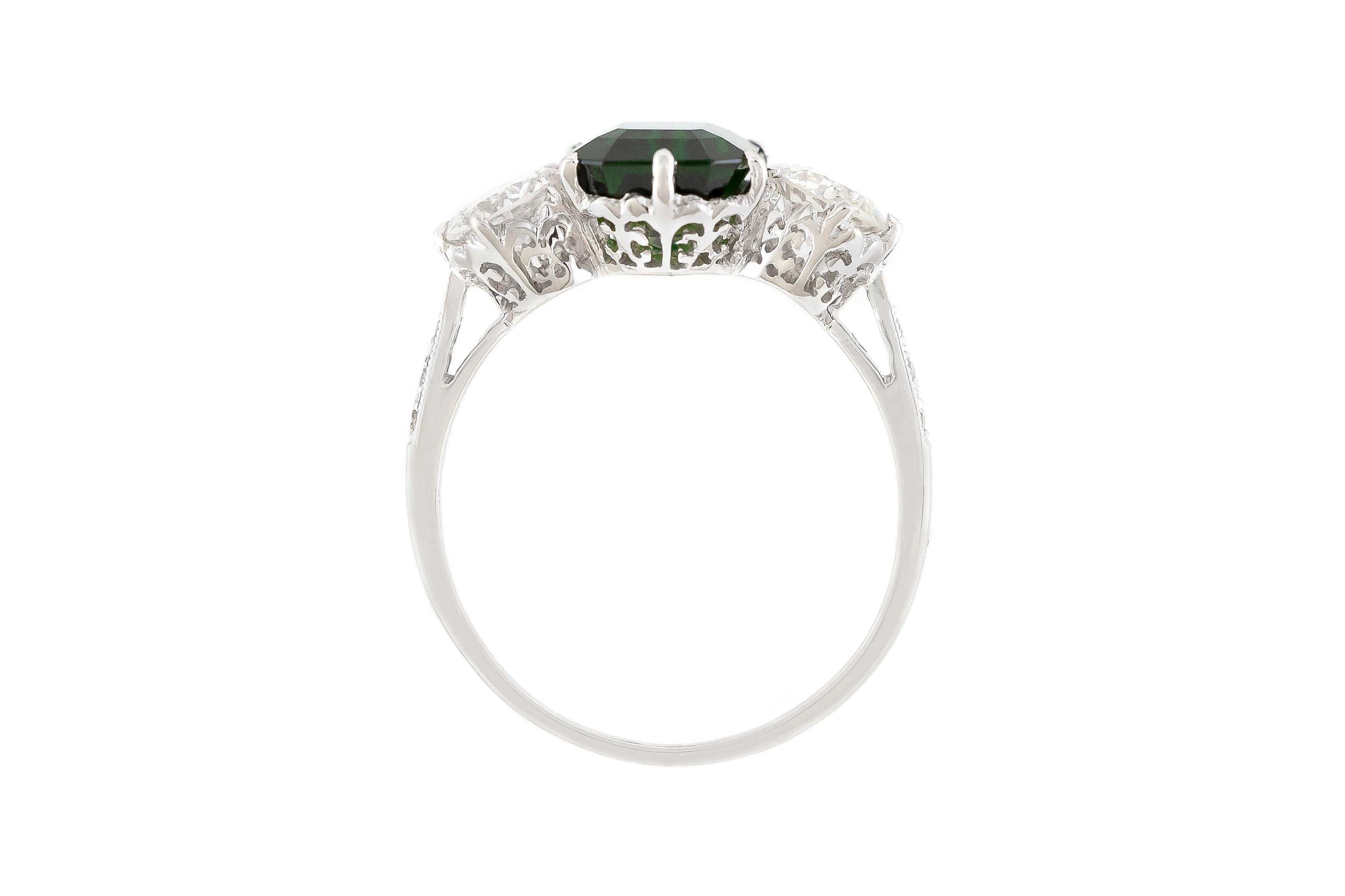 green stone engagement ring