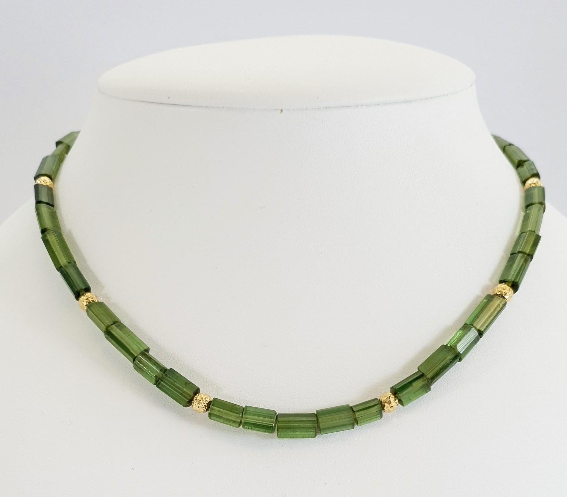 This Natural Green Tourmaline Crystal Beaded Necklace with 18 Carat yellow Gold is totally handmade. Cutting as well as goldwork are made in German quality. The lobster clasp is easy to handle. The crystals surface is completly natural and not