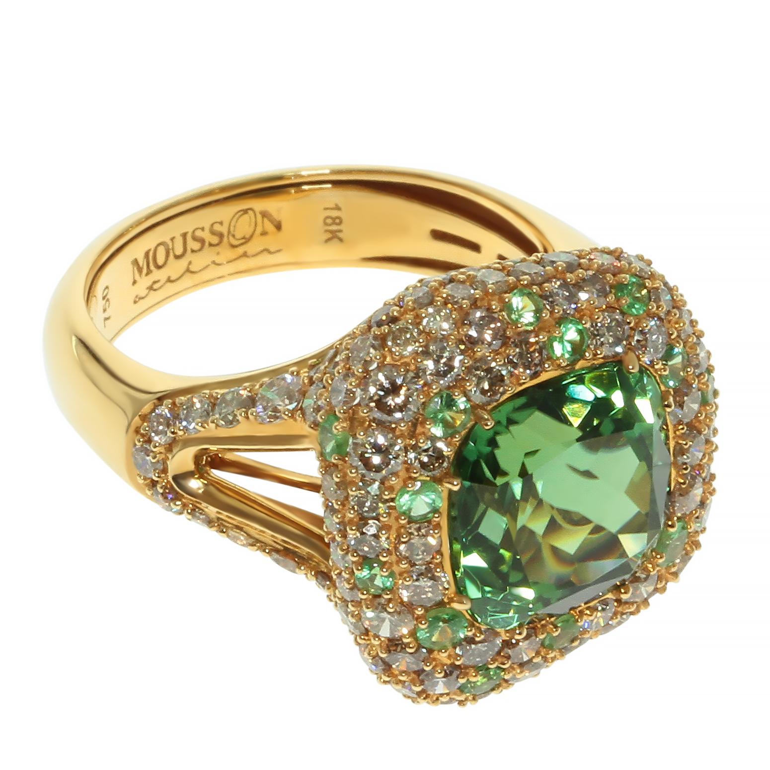 Green Tourmaline Diamond 18 Karat Yellow Gold Ring
Pure Green 5.2 carat Tourmaline supported by 2.67 carat of Champagne Diamonds and 0.52 carat of Tsavorites in this Ring.
Asymmetrical shape for those who want to wear and appreciate the design