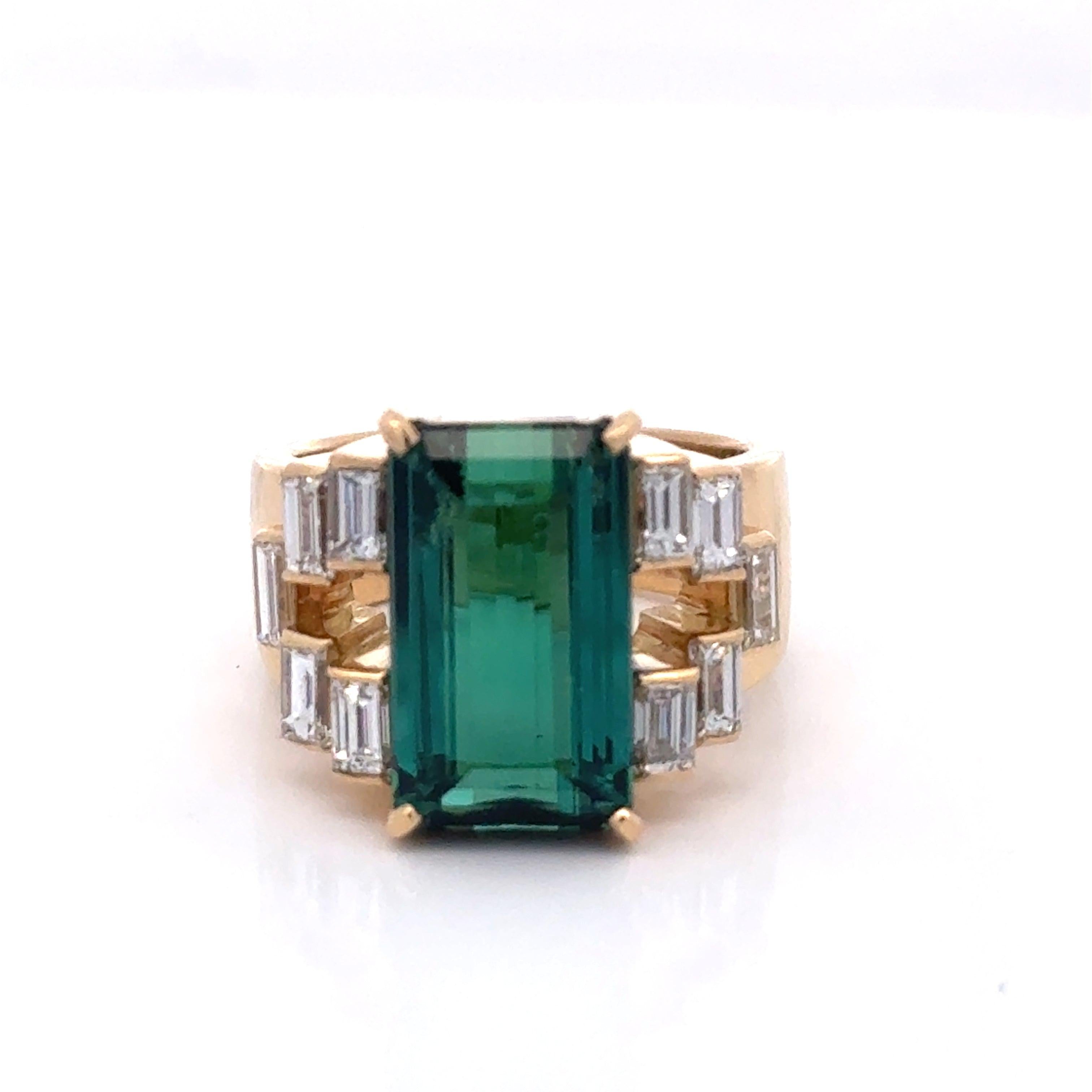 Estate Ring, 1 Green Tourmaline Emerald Cut 6.16 ct, 10 Emerald Cut Diamond 1.15 cttw  G-H VS2-SI1, 18K Yellow Gold 14.00g

Jewelry Type : Ring
Metal Type : 18K Yellow Gold
Metal Weight : 14.00 grams
Ring Size : 5.25
Brand : Estate
Center Stone :