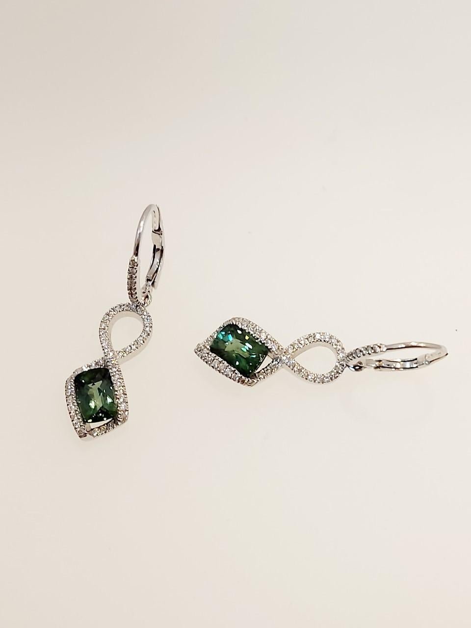 Pair of lovely green tourmaline and micro set diamond drop earrings total emerald cut tourmalines weight 2.12ct total diamond weight .47ct length of drop 34mm. Hook fitting with spring clip.