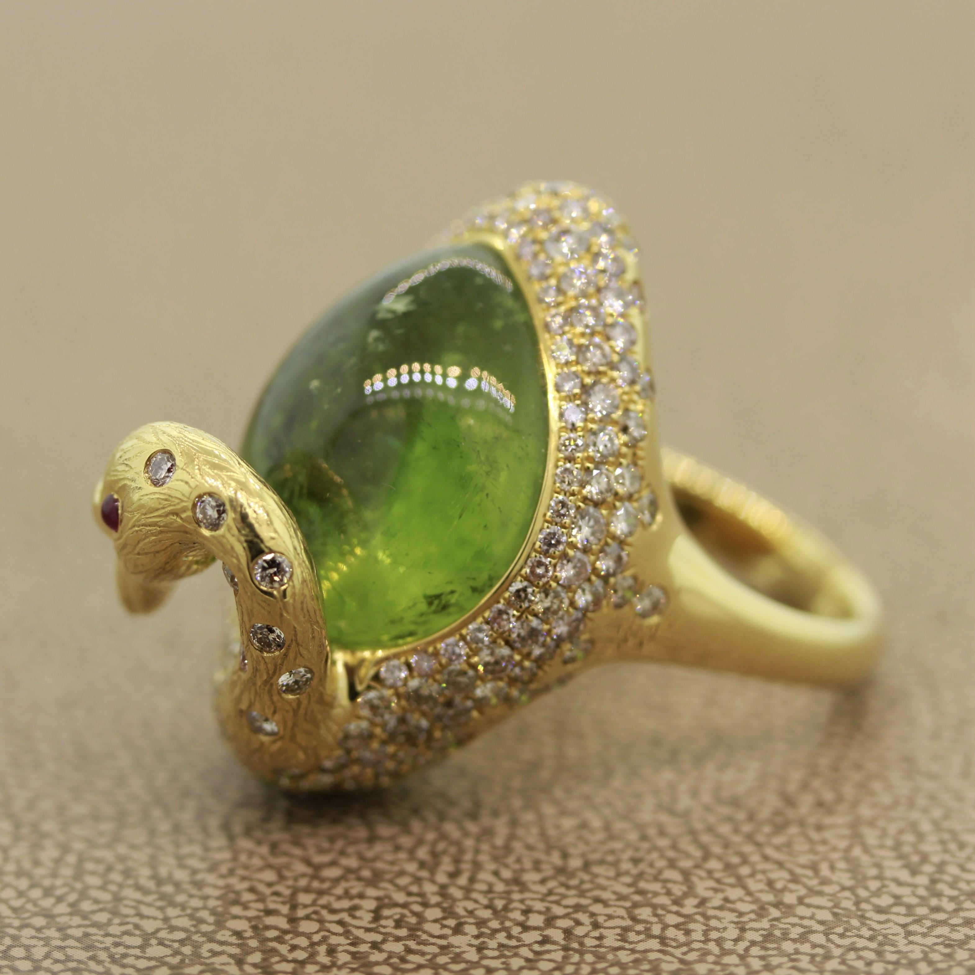 An unbelievably sweet swan ring. This cute piece features a 26.07ct green tourmaline cabochon. There are 2.75 carats of round brilliant cut diamonds set around the body and up the neck of the swan with 2 rubies eyes. The swan’s head has fine detail
