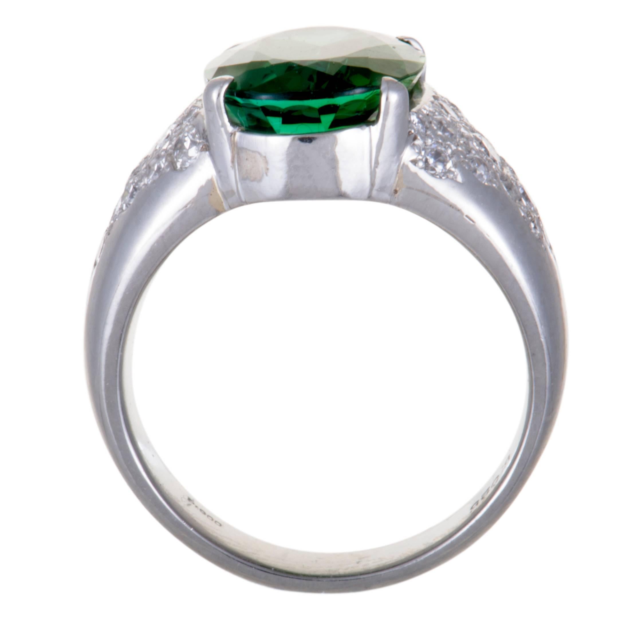 A look of absolute prestige and extravagance is achieved in this fabulous ring by combining the ever-luxurious platinum with incredibly resplendent gems. The ring is set with a majestic green tourmaline that is lustrously accentuated by a plethora