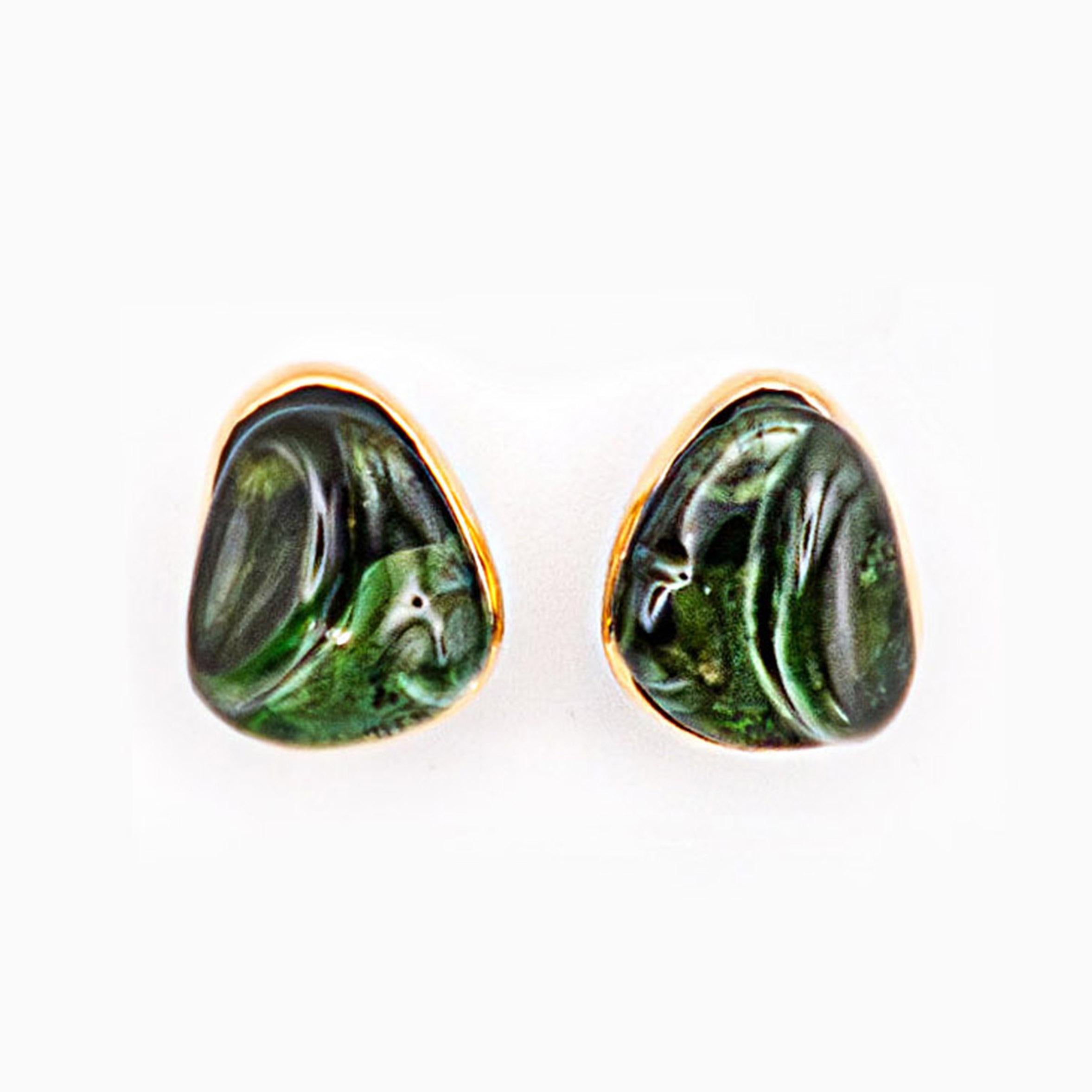 One pair of carved green tourmalines earrings
18K Gold - Signed Burle Marx

The handcrafted jewels of Haroldo Burle Marx are characterized by a timeless quality that reflects the era of Cleopatra and the concepts of tomorrow


