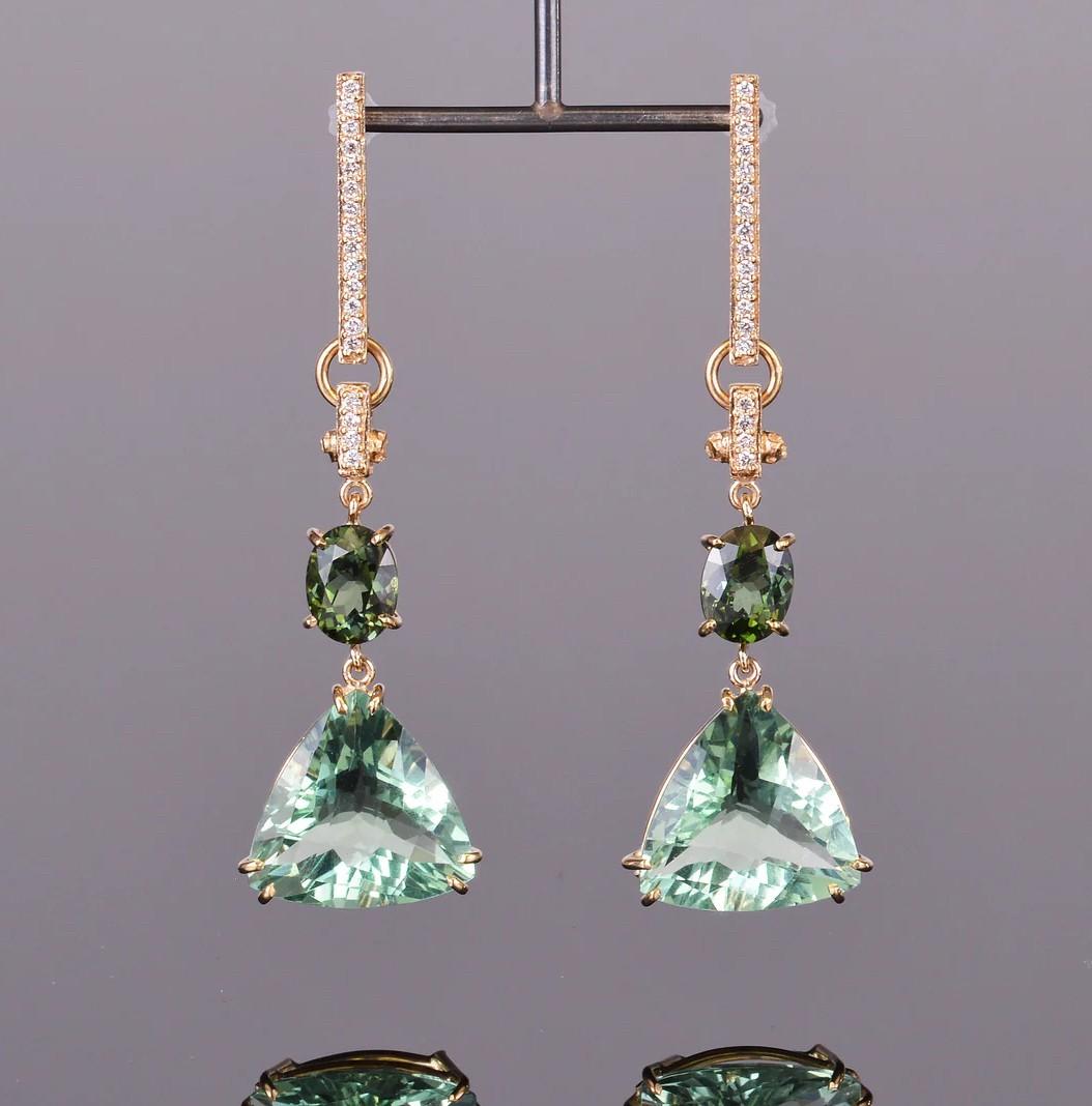 Make them green with envy! These earrings are magnificent. They feature fluorite, green tourmaline and diamond all hand set in 14k yellow gold.