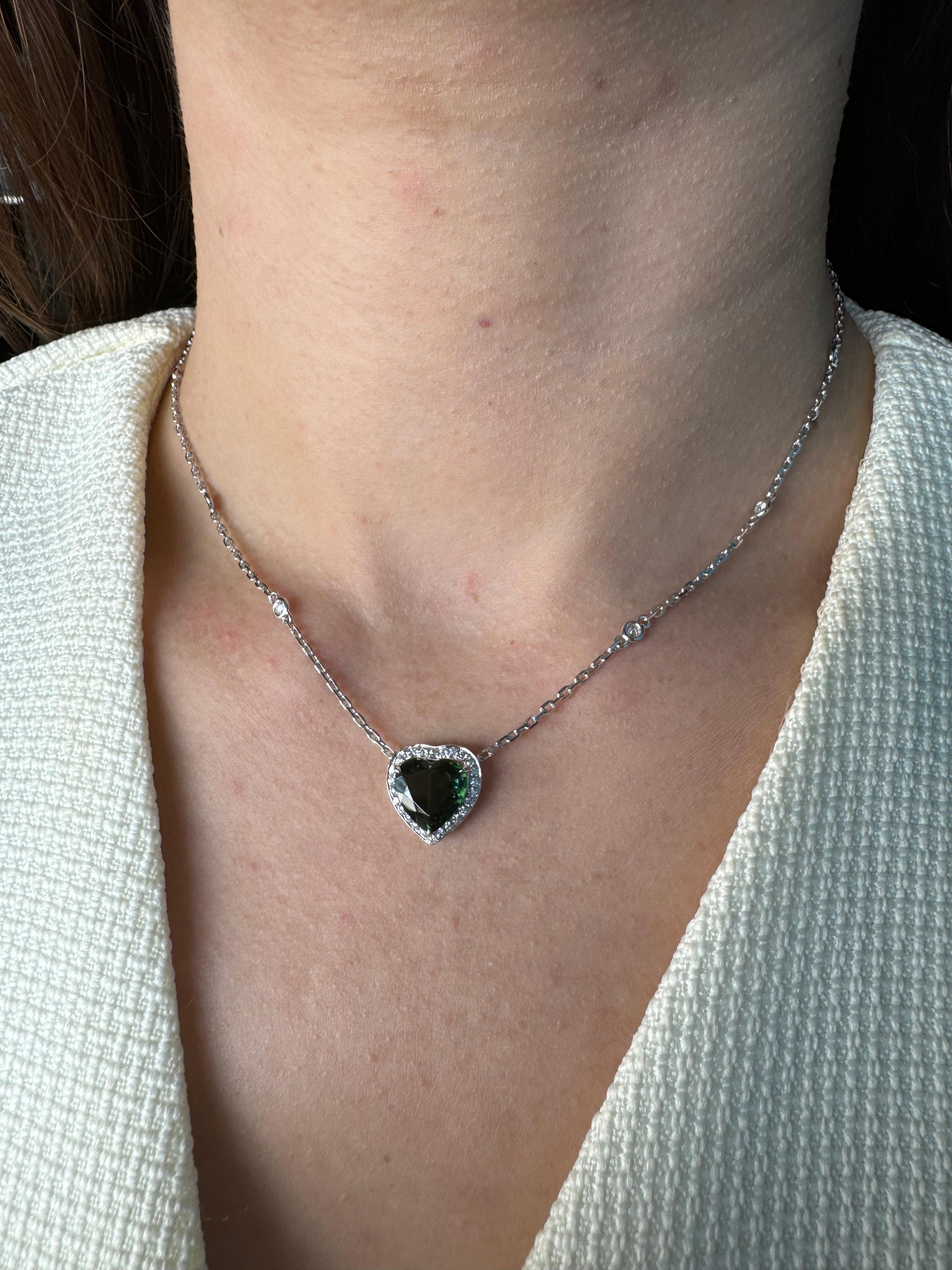 Embrace the refined beauty of this exquisite gemstone heart-shape pendant necklace.  Crafted with solid 18K gold and intricate detailing, the necklace features the highest-quality faceted diamond-cut chain that gracefully holds a natural brilliant