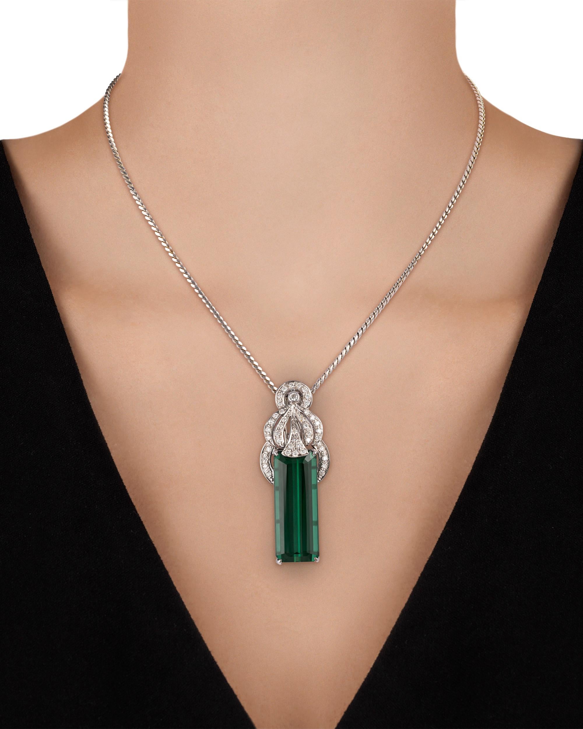 The emerald-cut tourmaline in this pendant weighs a monumental 37.63 carats and displays a rich green hue that rivals that of an emerald. The classic gem is set in platinum with diamonds totaling approximately 1.50 carats.

Pendant: 2