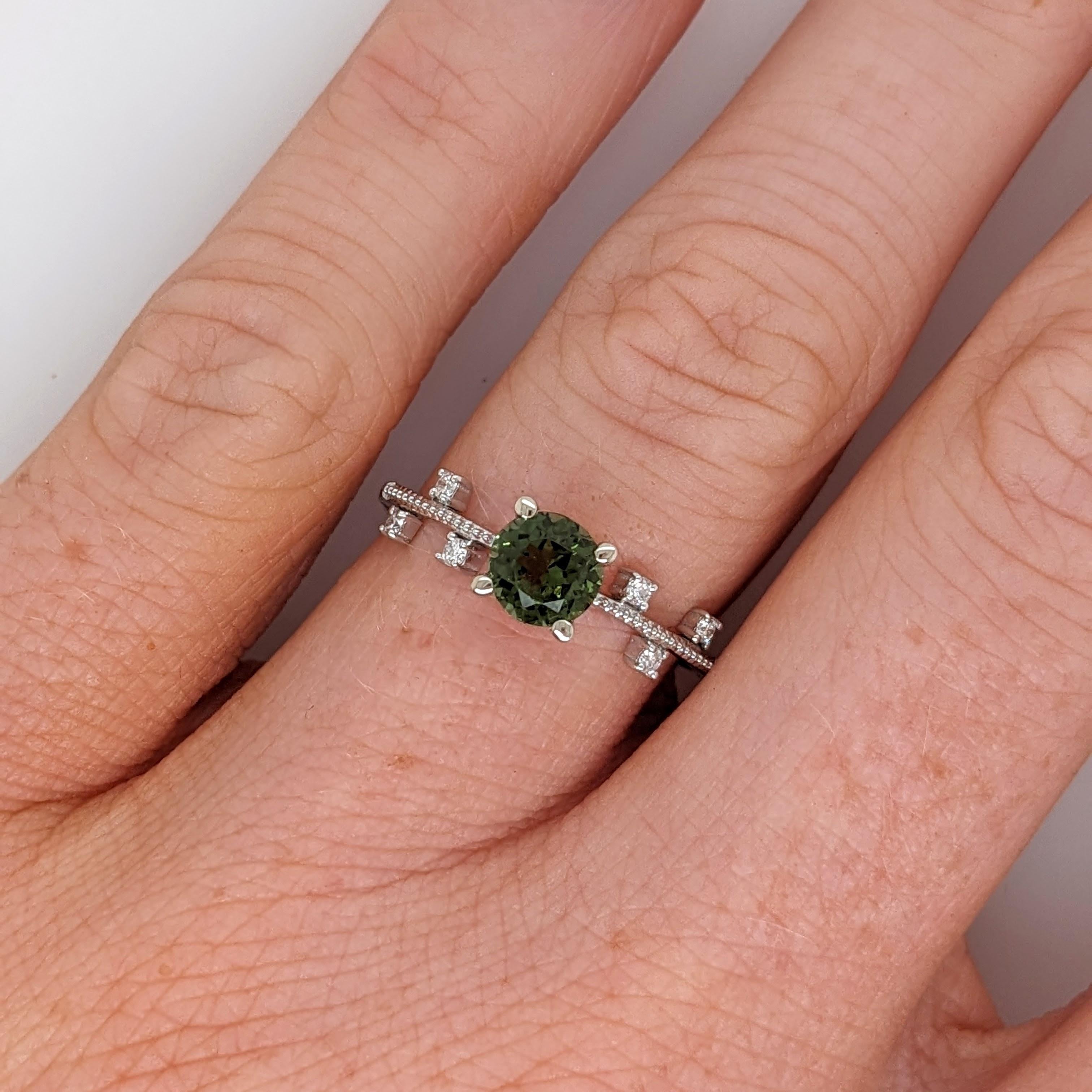 This beautiful ring features a 0.81 carat round green tourmaline gemstone with natural earth mined diamonds and milgrain detail, all set in solid 14K gold. This ring can be a lovely October birthstone gift for your loved ones! 

Specifications

Item