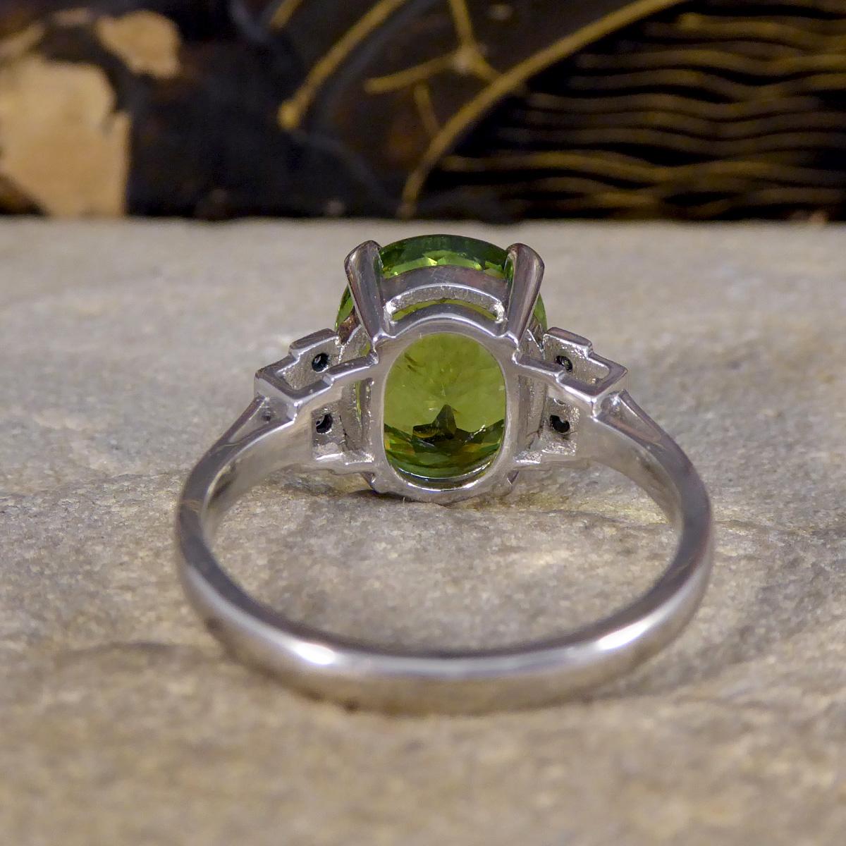 Oval Cut Green Tourmaline Ring with Diamond Staged Shoulders in Platinum