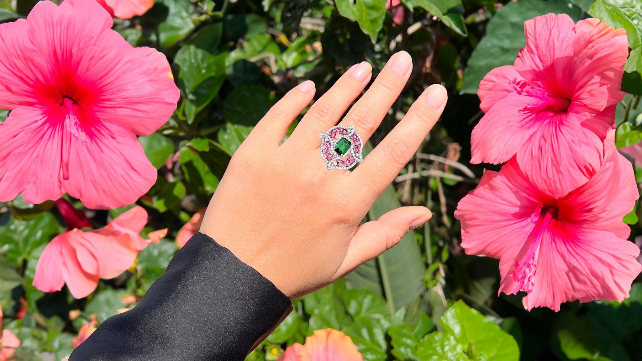 It comes with the Gemological Appraisal by GIA GG/AJP
All Gemstones are Natural
Green Tourmaline = 2.15 Carat
12 Pink Tourmalines = 1.70 Carats
40 Diamonds = 1.22 Carats
Metal: Black Rhodium Plated Sterling Silver
Ring Size: 7.5* US
*It can be