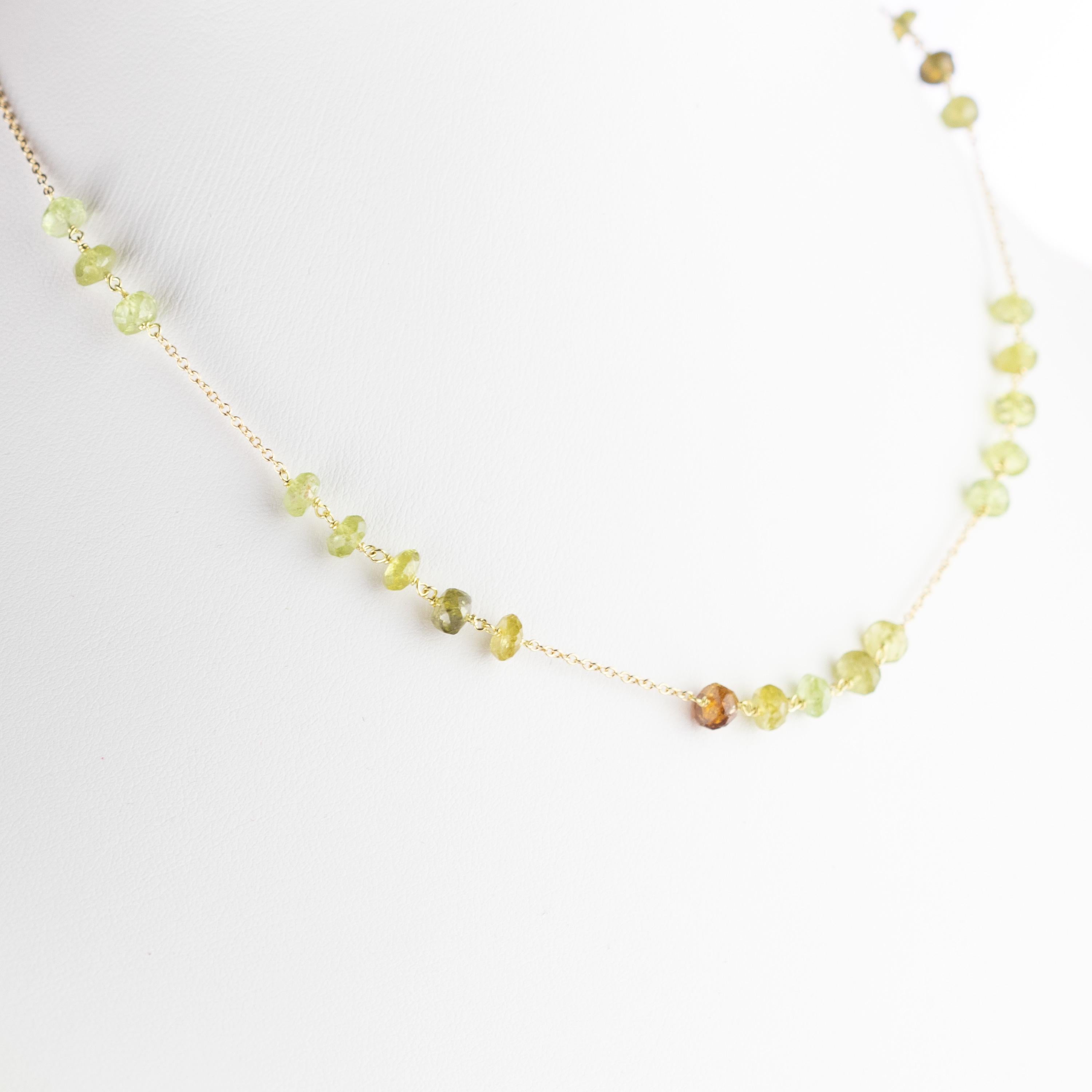 Marvellous necklace starring natural green tourmaline rondelles gems, for a bright charm of uniqueness. Luminous jewel with natural precious jewellery on elegant 18 karat yellow gold setting.

Green represents abundance, renewal, growth and nature.