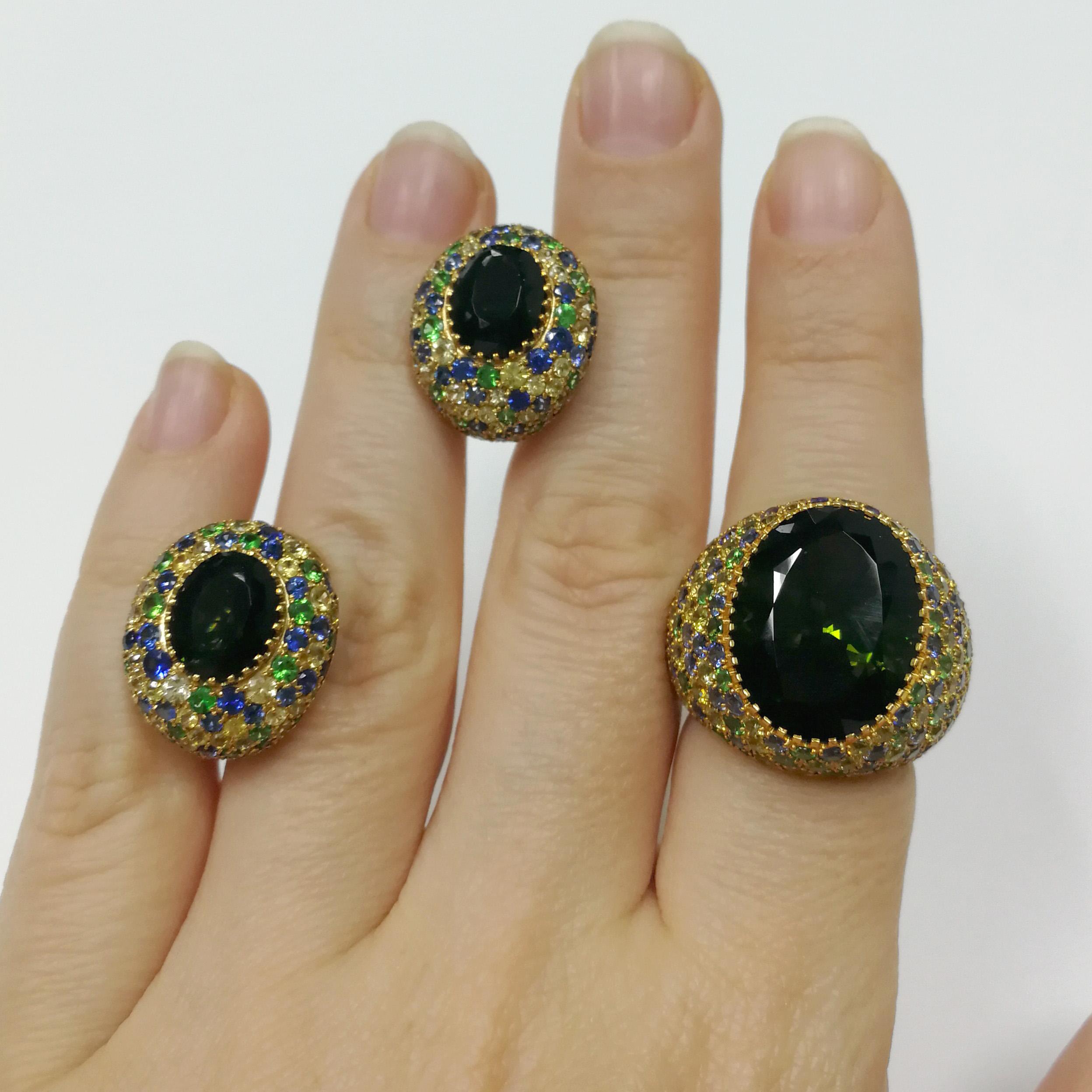 Green Tourmaline Tsavorites Sapphires Yellow 18 Karat Gold Riviera Suite

Please request a video link to check this beauty in action
Ring:
US Size 7 1/4//  EU Size 54 5/8
24.50 x 21.80 mm (WxH)
Weight - 13.55 gm.
Earrings:
16.20 x 18.90 mm