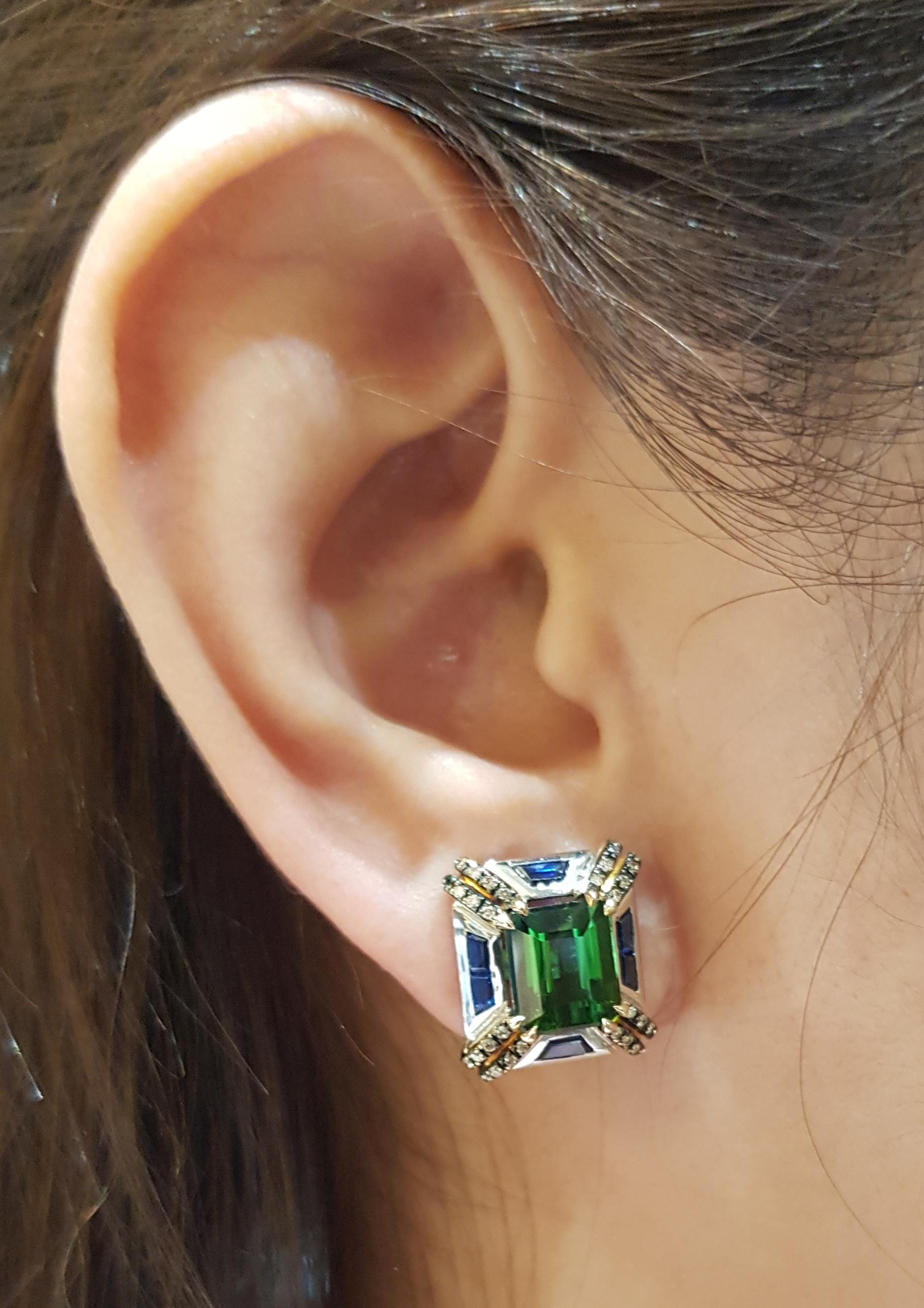 Green Tourmaline 6.50 carats with Blue Sapphire 2.70 carats and Brown Diamond 0.36 carats Earrings set in 18 Karat Gold Settings

Width:  1.3 cm 
Length: 1.5 cm
Total Weight: 11.21 grams

