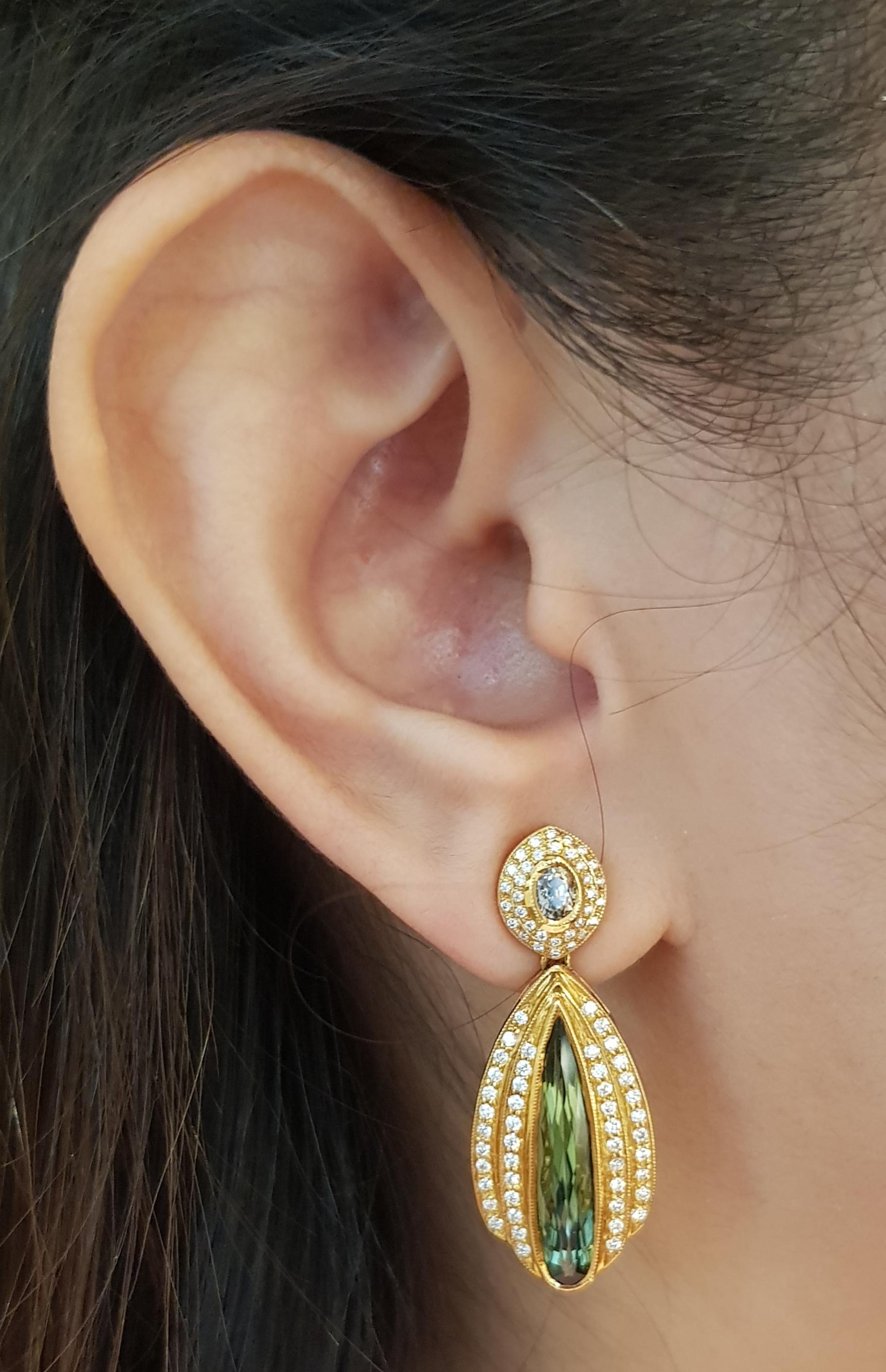 Green Tourmaline 3.99 carats with Brown Sapphire 0.57 carat and Diamond 0.72 carat Earrings set in 18 Karat Gold Settings

Width:  1.3 cm 
Length:  3.4 cm
Total Weight: 13.0 grams

