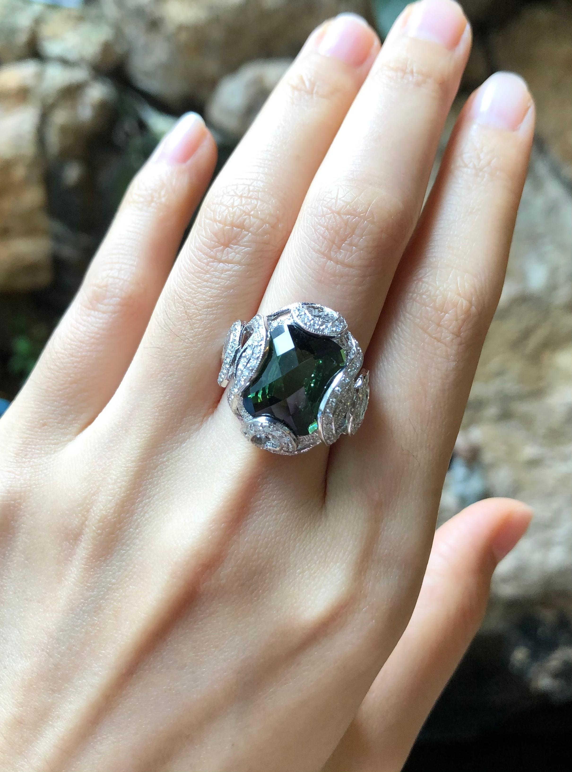 Green Tourmaline 9.47 carats with Diamond 1.17 carats Ring set in 18 Karat White Gold Settings

Width:  1.8 cm 
Length:  2.1 cm
Ring Size: 52
Total Weight: 10.82 grams

