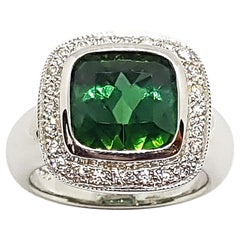 Bague en or blanc 18 carats ornée d'une tourmaline verte et d'un diamant
