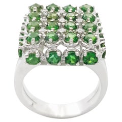Bague en or blanc 18 carats ornée d'une tourmaline verte et d'un diamant