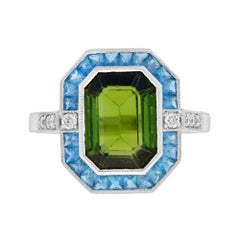 Turmalina verde certificada Londres Topacio azul Anillo con halo de diamantes en oro blanco de 14 quilates