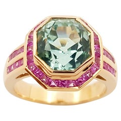 Anillo de turmalina verde con zafiro rosa engastado en oro rosa de 18 quilates