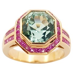 Bague en or rose 18 carats sertie de tourmaline verte et de saphir rose