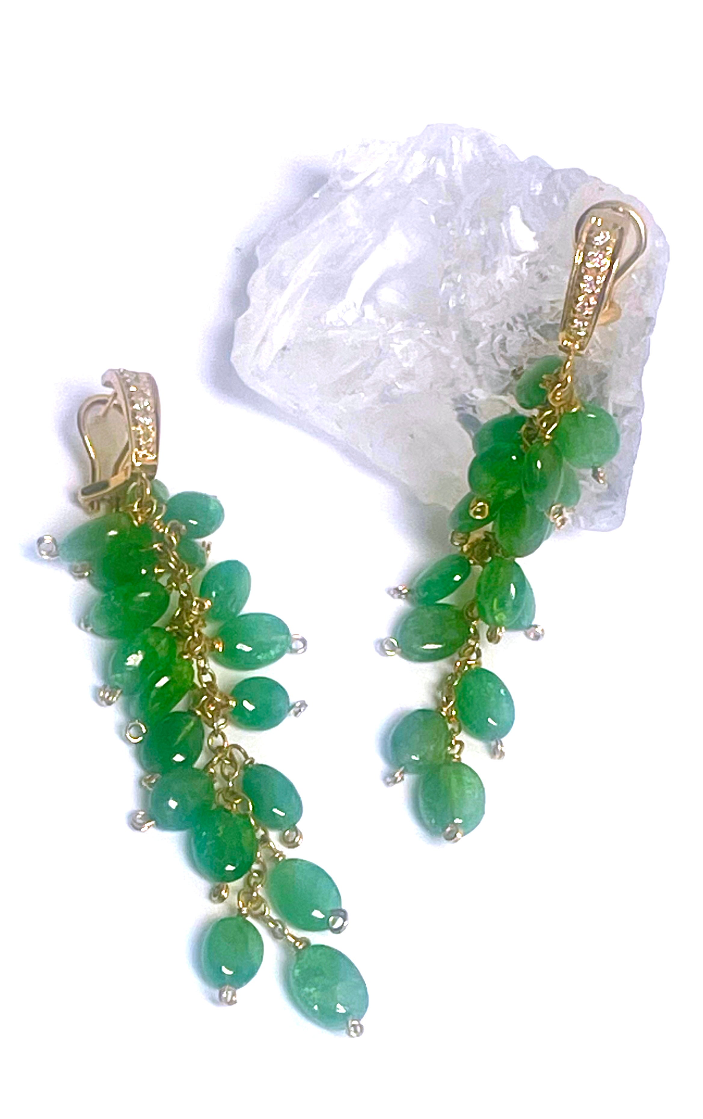 Description
Carefree cascade of Tsavorites, the rarest of Garnets, individually selected, arranged and hand wire-wrapped to dance with delight with your every move as they dangle from 14k yellow gold and diamond posts with easy to use omega