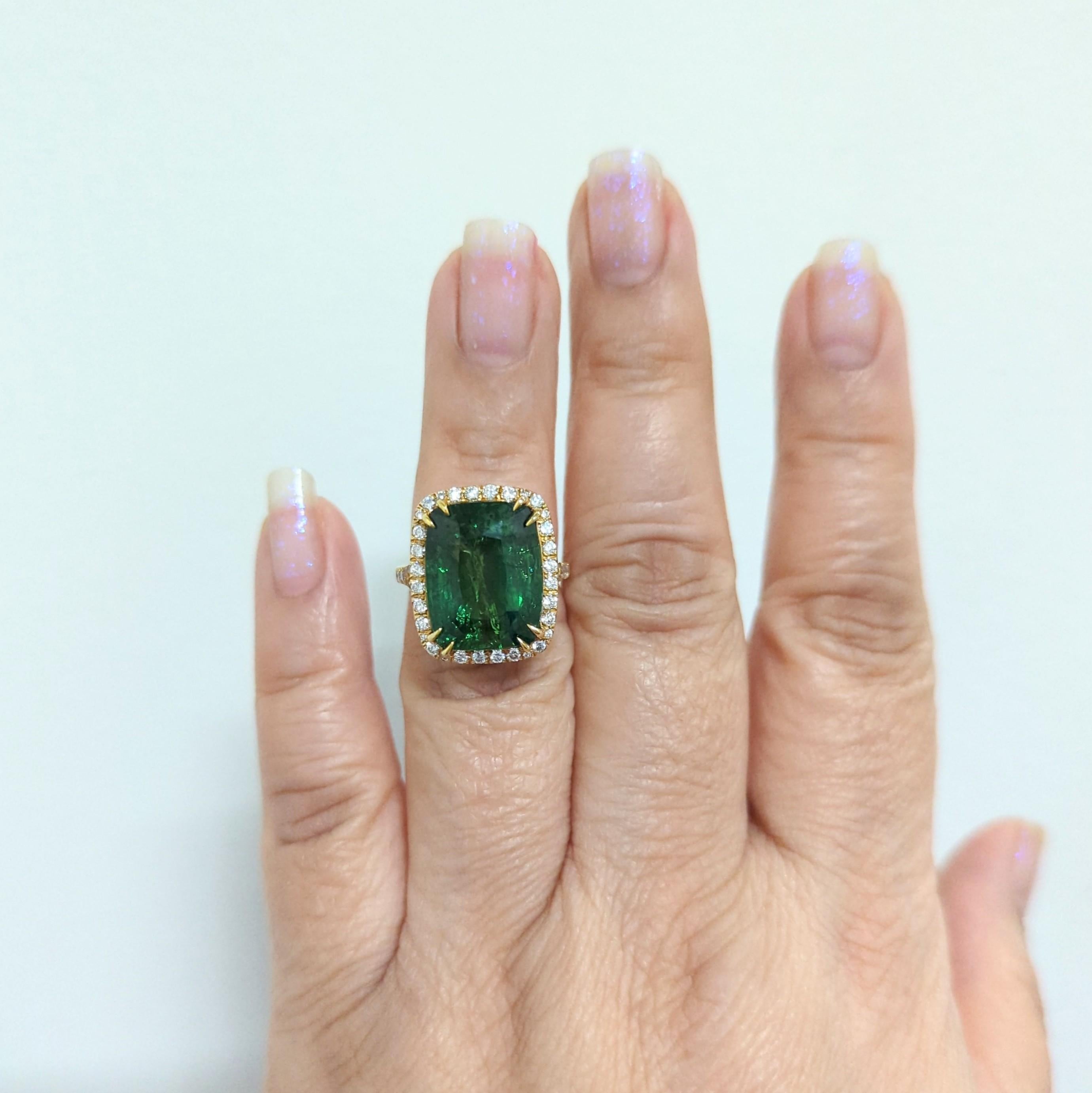 Gorgeous 15.50 carat green tsavorite cushion with 0.77 carats of diamond rounds in 18k yellow gold.  This beautiful cocktail ring is size 5.75 and perfect for any occasion.  A rich forest green hue that pops with the white diamond accents and yellow