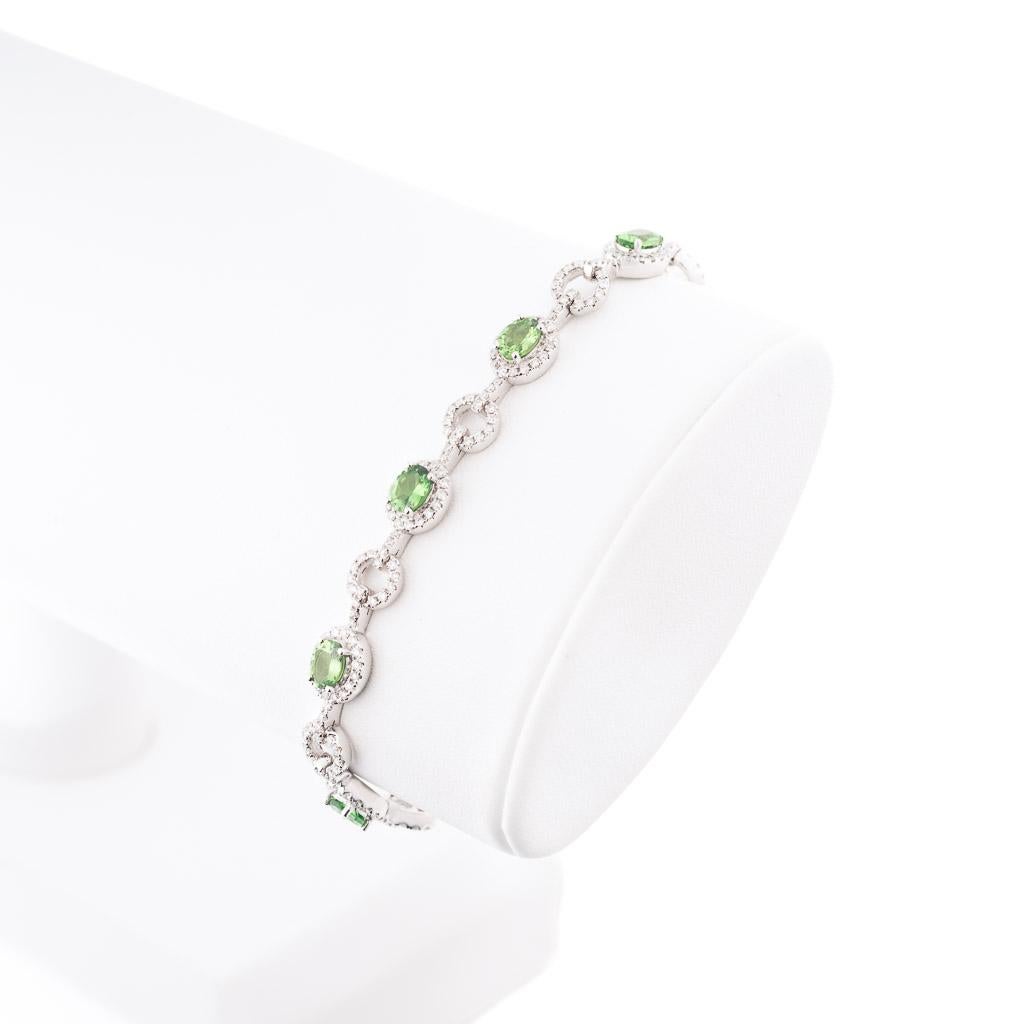 Rare African green Tsavorite and diamond bracelet features
9 x Natural oval Green Garnets = 3.28ct and D x 302 = 1.34ct E/ VS1 collection quality diamonds .
Beautiful and naturally captivating ,this magnificent one of a kind piece is handcrafted in