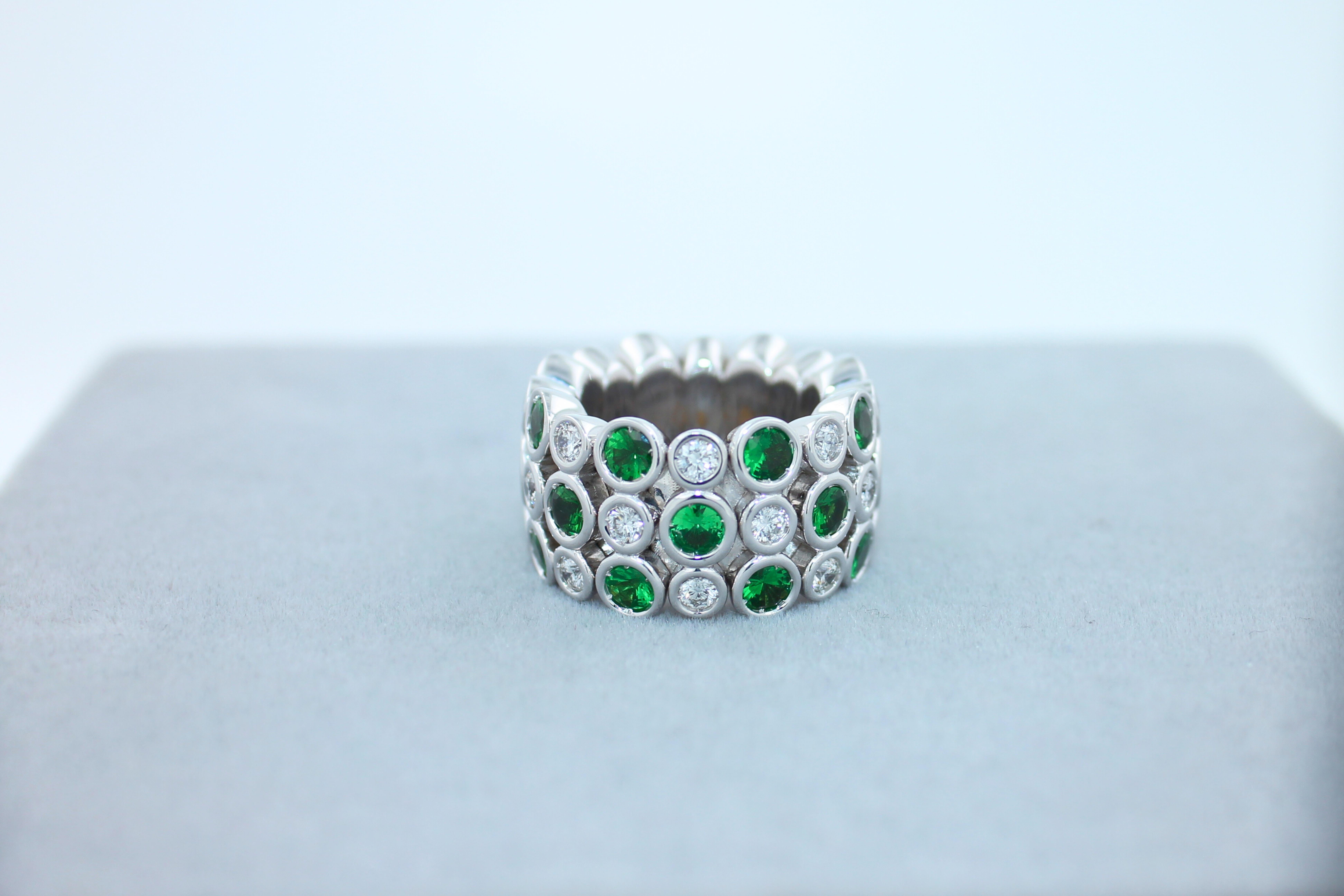 green tsavorite and diamond eternity ring