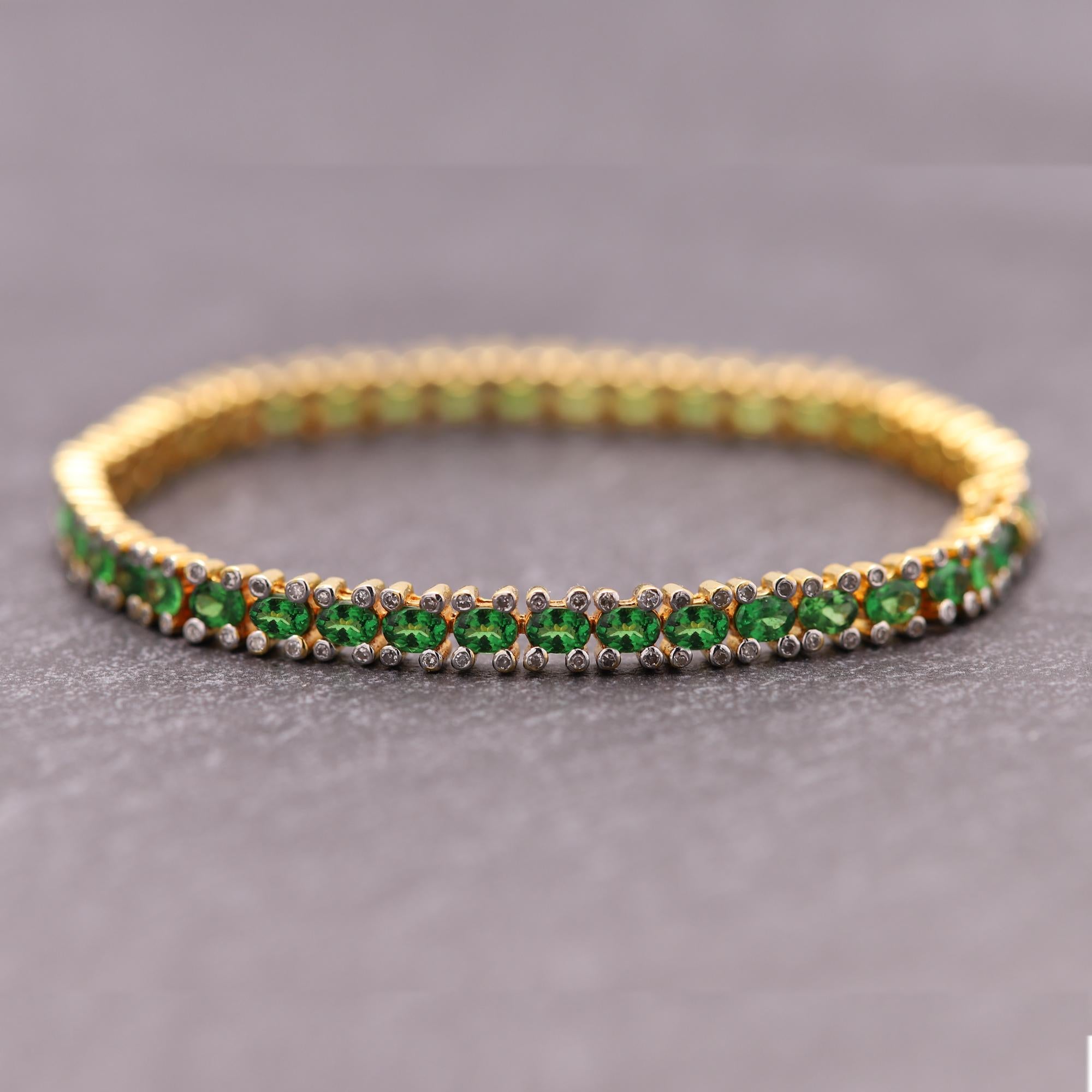 Brilliant Green Gemstones of Green Tsavorite set in
14k Yellow Gold (top area is white Gold) approx 15.0 grams.
all stones are natural !
total tsavorite 42 stones - approx  8.40 carat AAA
Total Diamonds approx 0.90 carat H-I-I1
Bracelet Length 7.25'