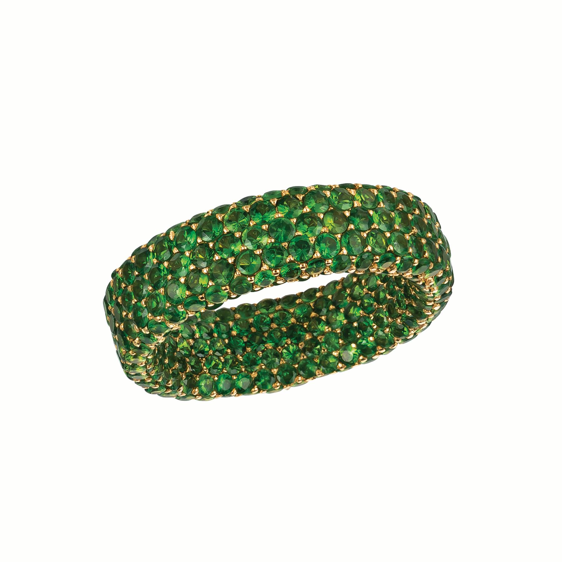 This unique design truly covers your finger in rare Tsavorite garnets. Named the 