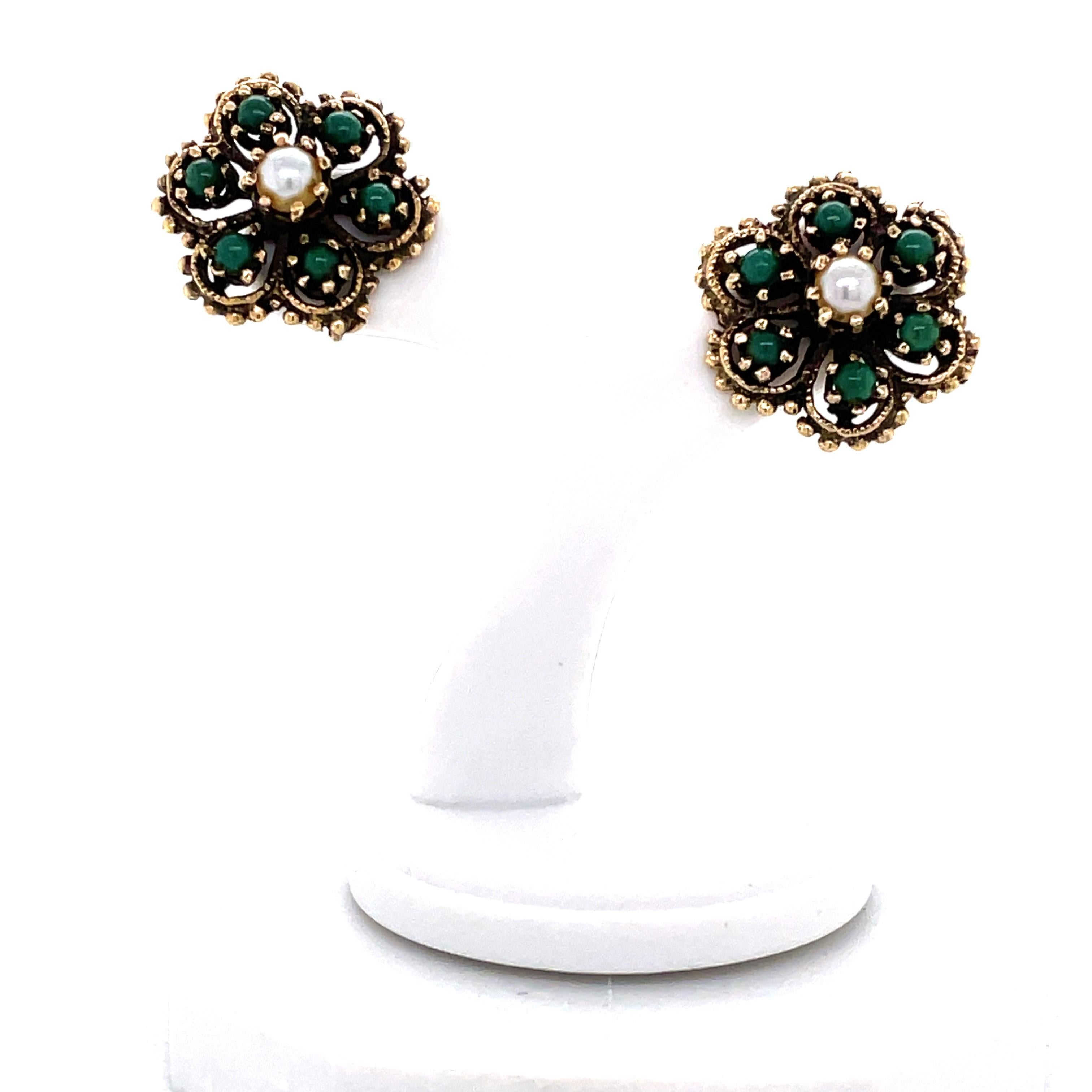 Colorful green turquoise accents the six petals of these adorable  antique style 14 karat yellow gold bud earrings with pearl centers. These stud earrings measure 5/8 inch round and have post backs for pieced ears. Gift boxed.