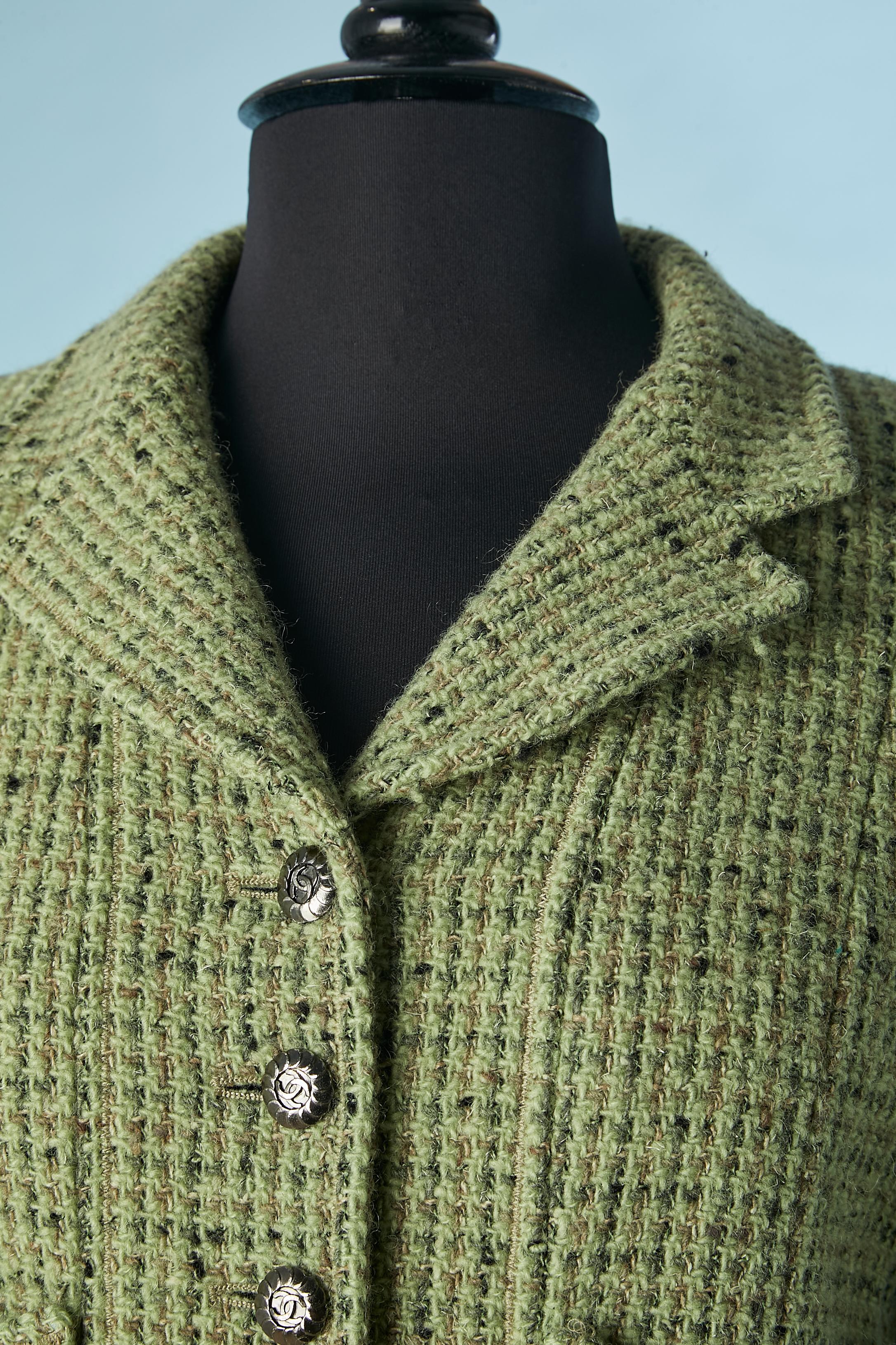 Green tweed single breasted jacket. Main fabric composition ( tweed) 93% wool, 6% silk, 1% nylon. Branded Lining composition: 95% silk, 5% lycra Shoulder pad. Chain in the inside bottom. 
SIZE 40 (Fr) L 