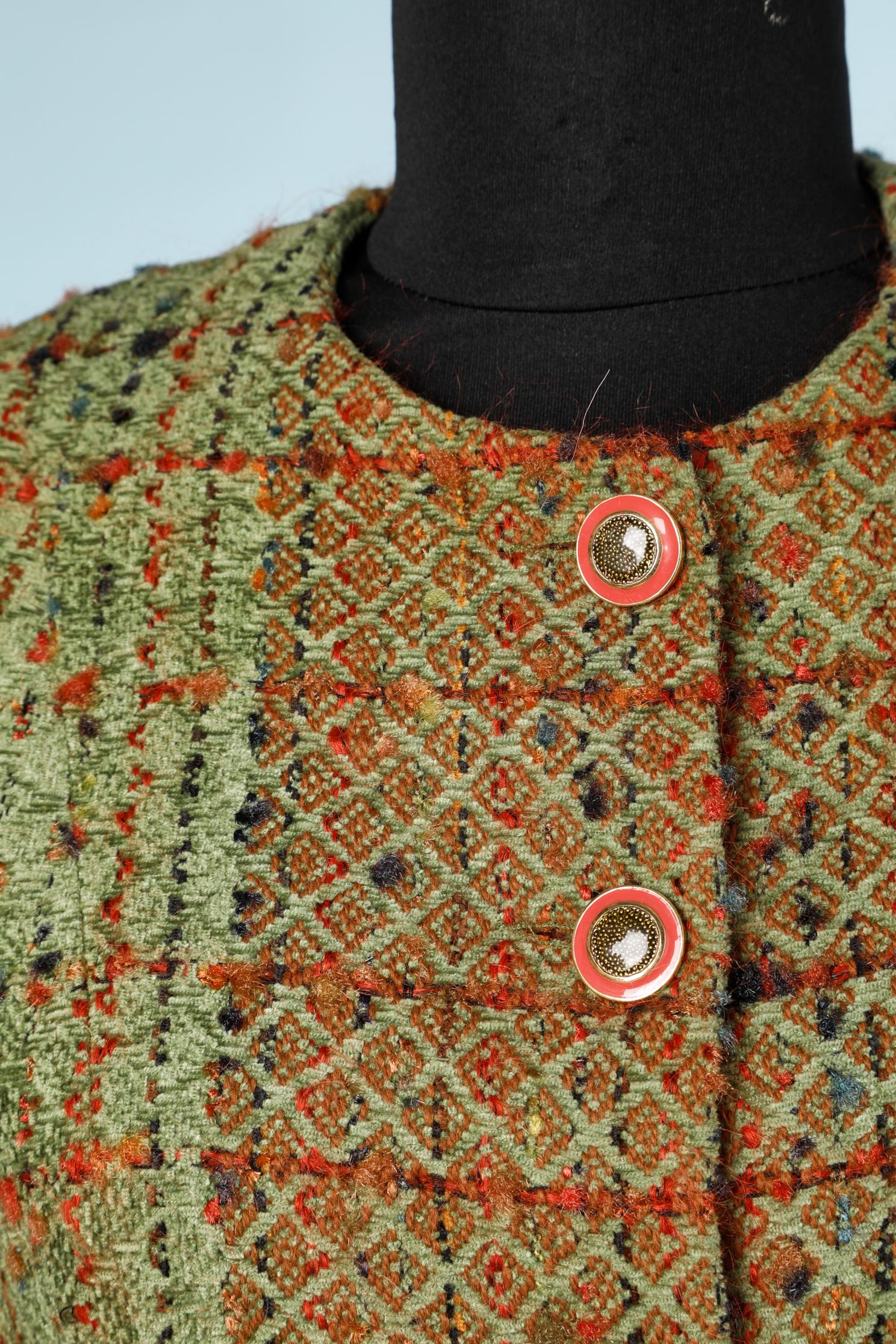 Green tweed skirt-suit. Shoulder-pad. Button and buttonhole closure on the middle front. 
Numbered on tag : 63080
Size 38 (fR) M 