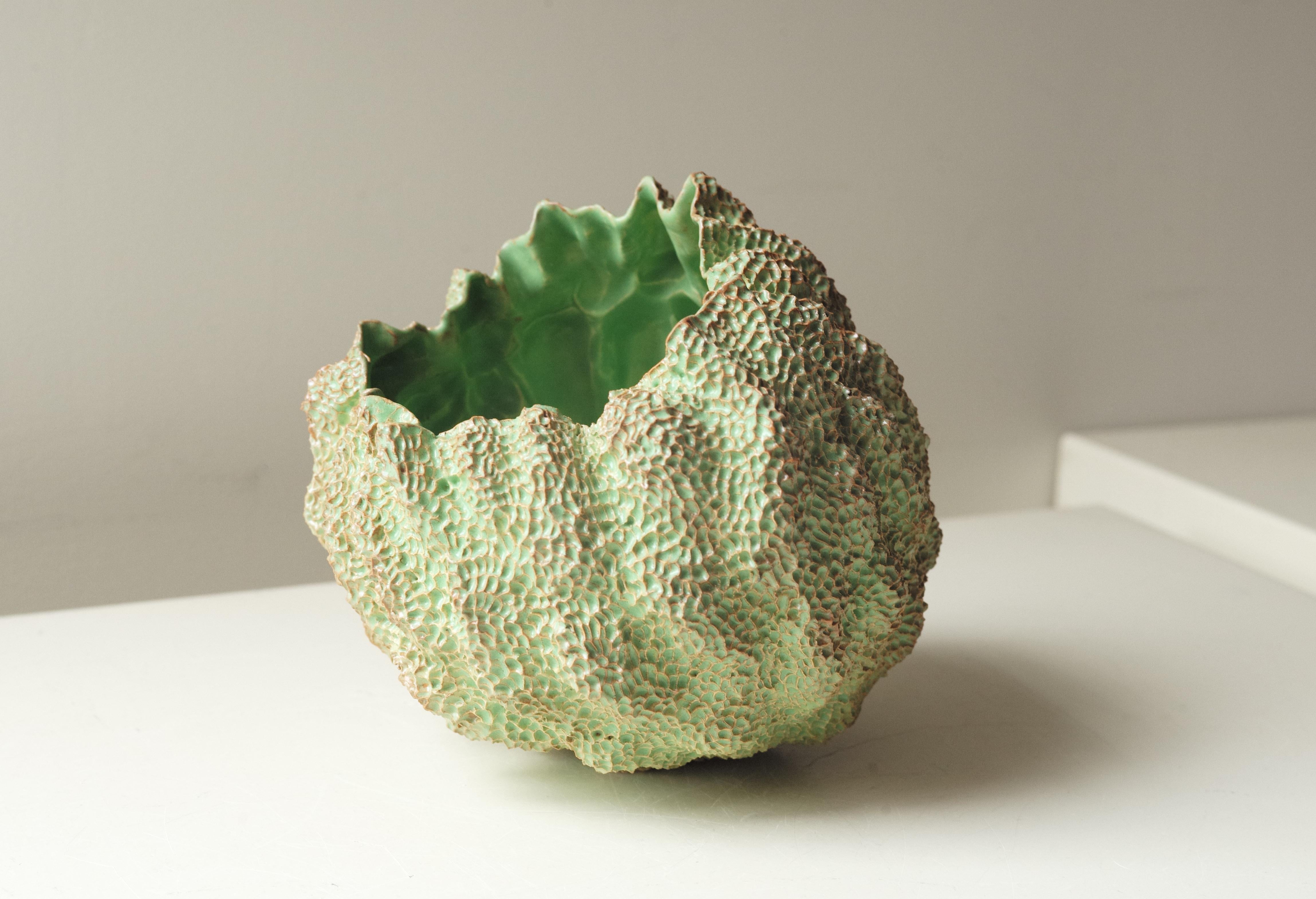 Hand-sculpted and meticulously carved ceramic sculpture. Glazed in lime green glaze that breaks into light brown on the edges. Created in 2016 by Lana Kova. Unique work.