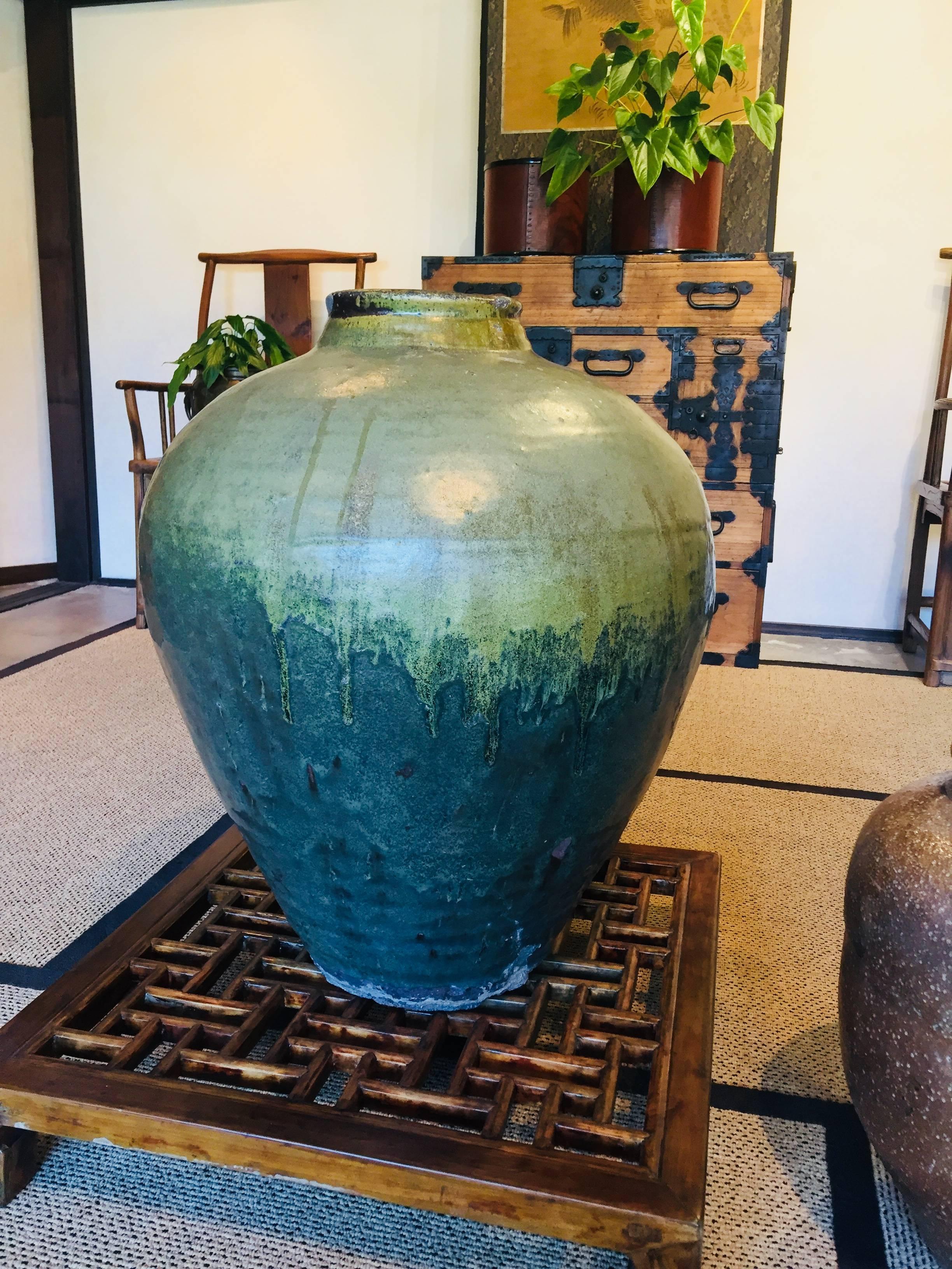 This large green glazed vase is from China, circa 1850.
This particular glaze is called tea dust glaze.\
 