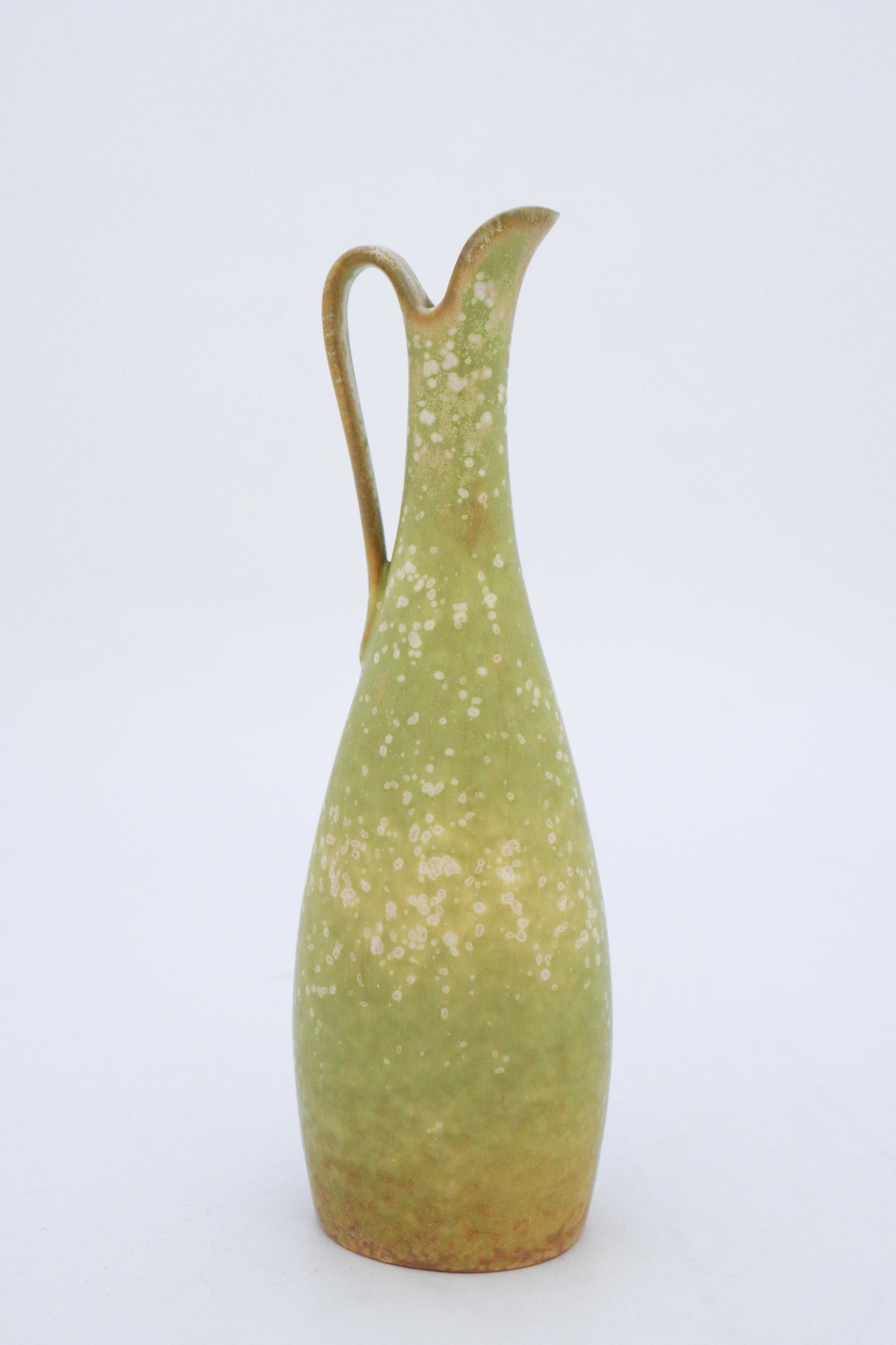 A lovely green vase with handle designed by Gunnar Nylund at Rörstrand, it´s 25 cm high and it has a lovely glaze, it´s in excellent condition and marked as 1st quality.

Gunnar Nylund was born in Paris 1904 with parents who worked as sculptors