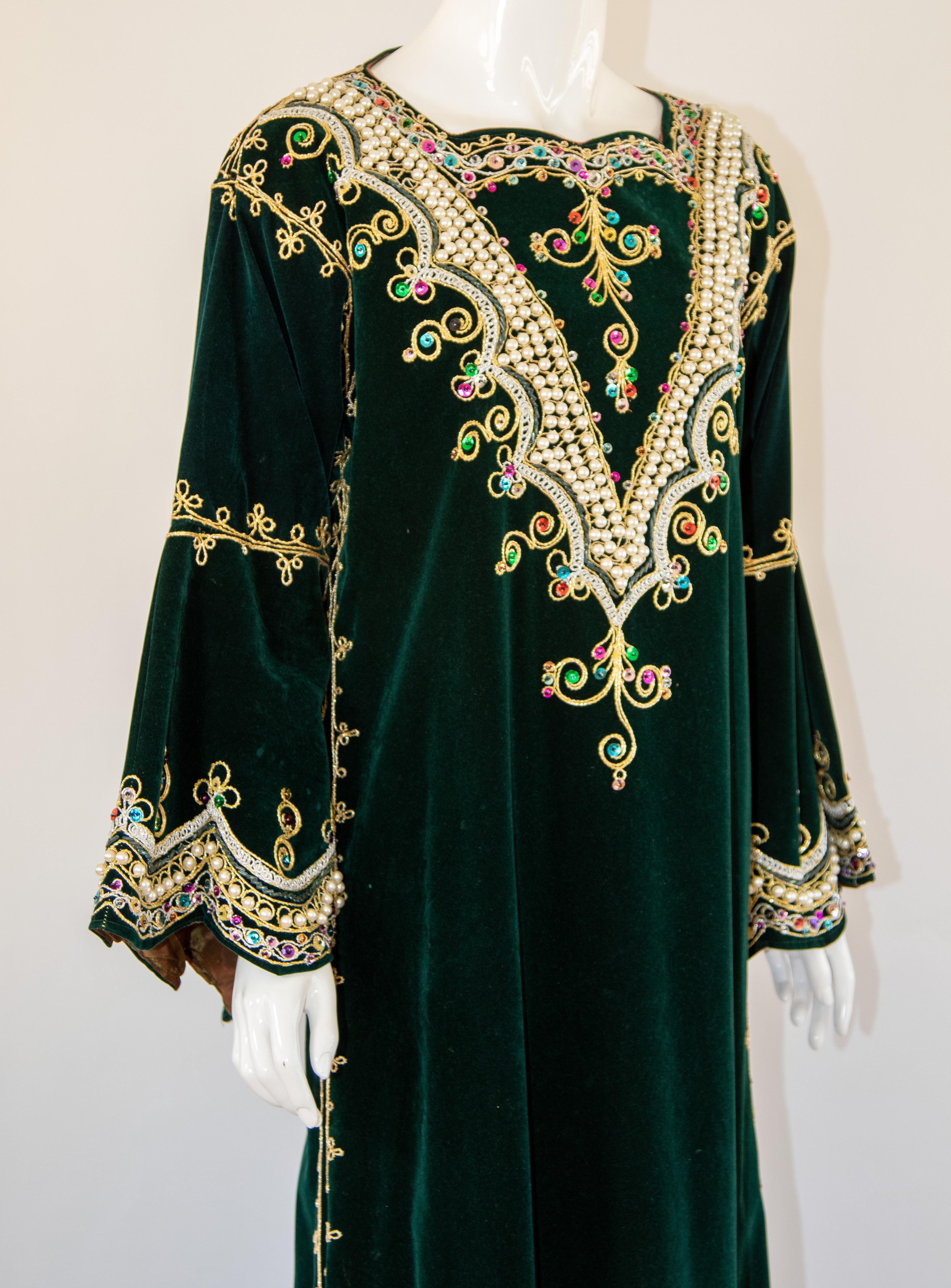 The Bindalli Caftan is a garment made for special occasions such as weddings. 
Bindallis were worn by the bride, and her female family and friends. 
Marked by elaborate floral designs bindallis were decorated with dival embroidery, a technique in